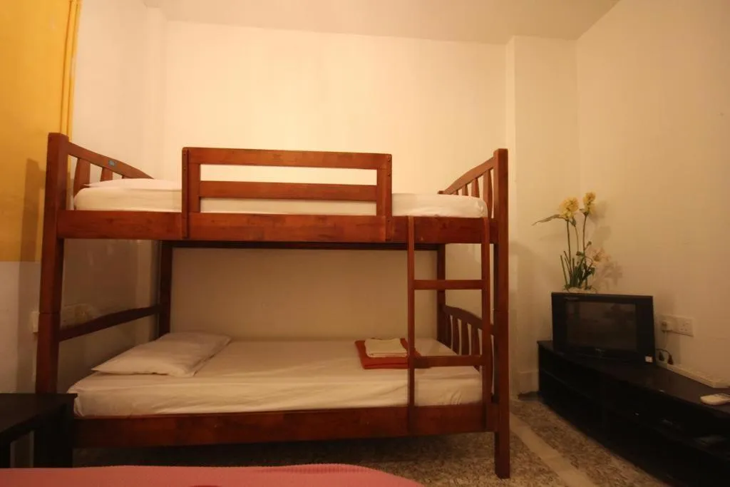 Bed in Cocoa Mews Cafe and Homestay