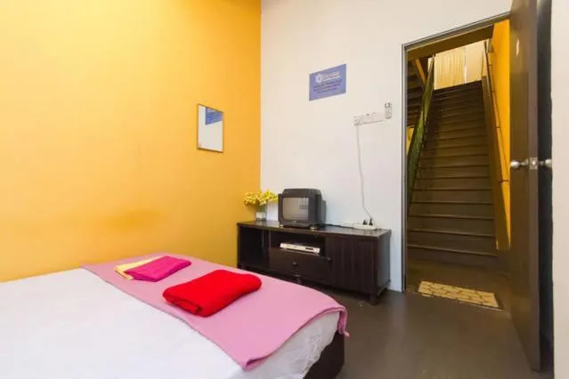 Bed in Cocoa Mews Cafe and Homestay