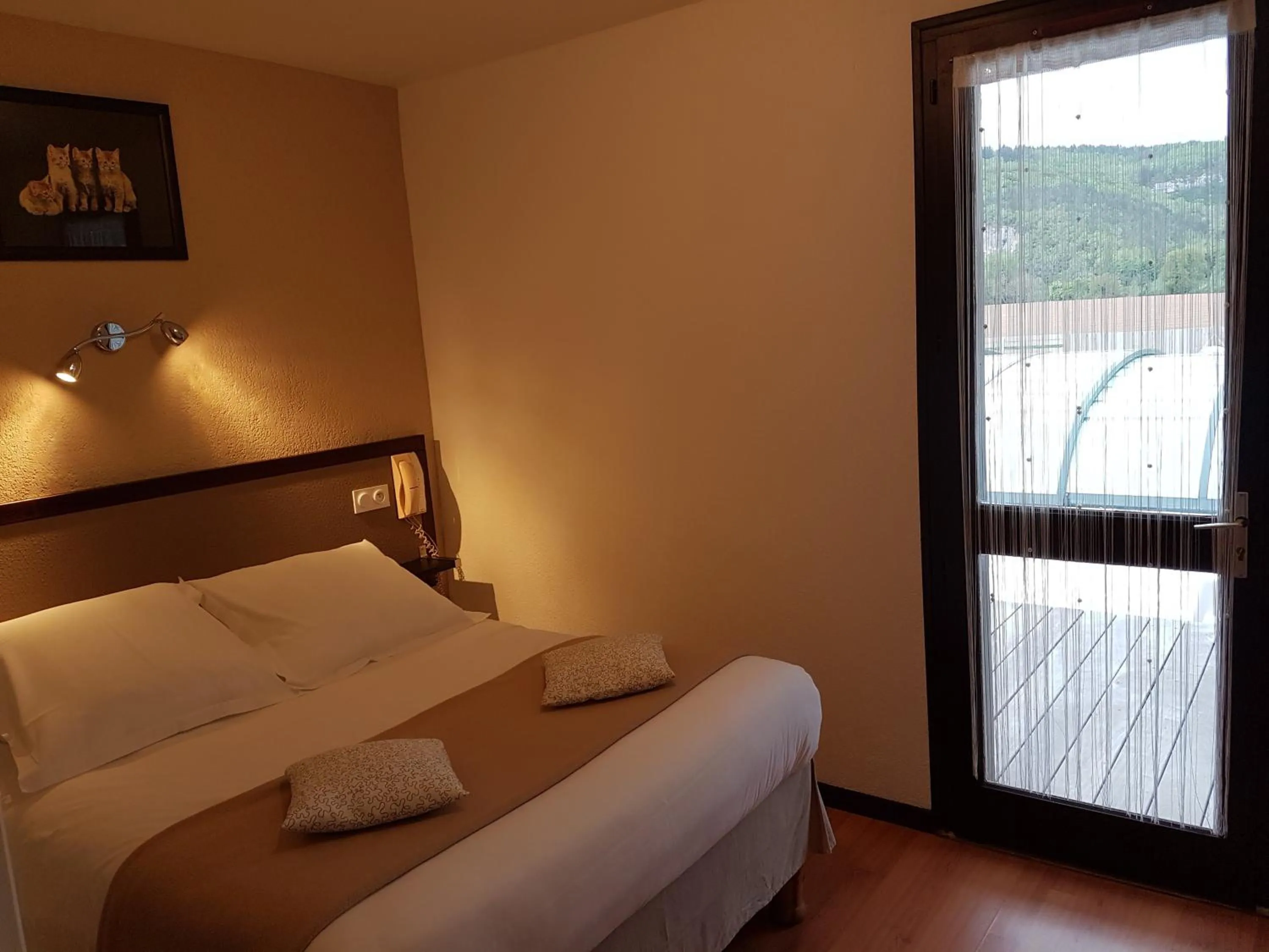 Quadruple Room (2 Adults + 2 Children) - ground floor in Hôtel Les Gabarres