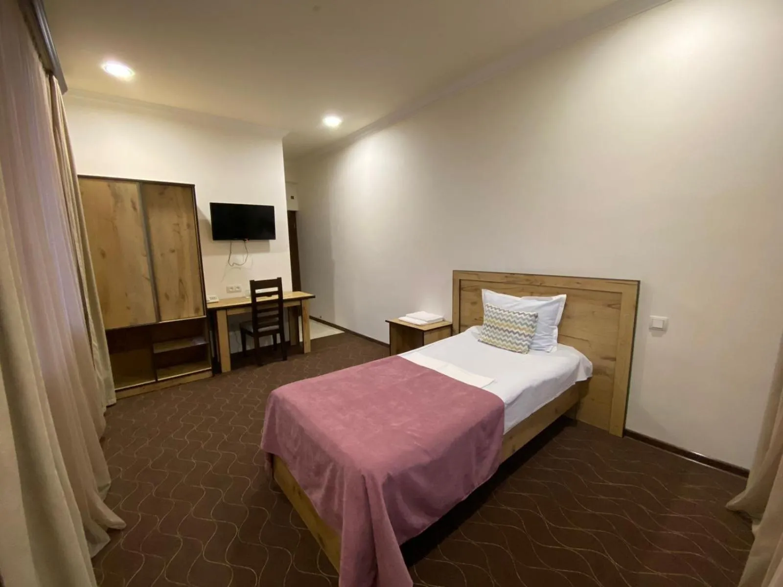 Bed in Mina Hotel