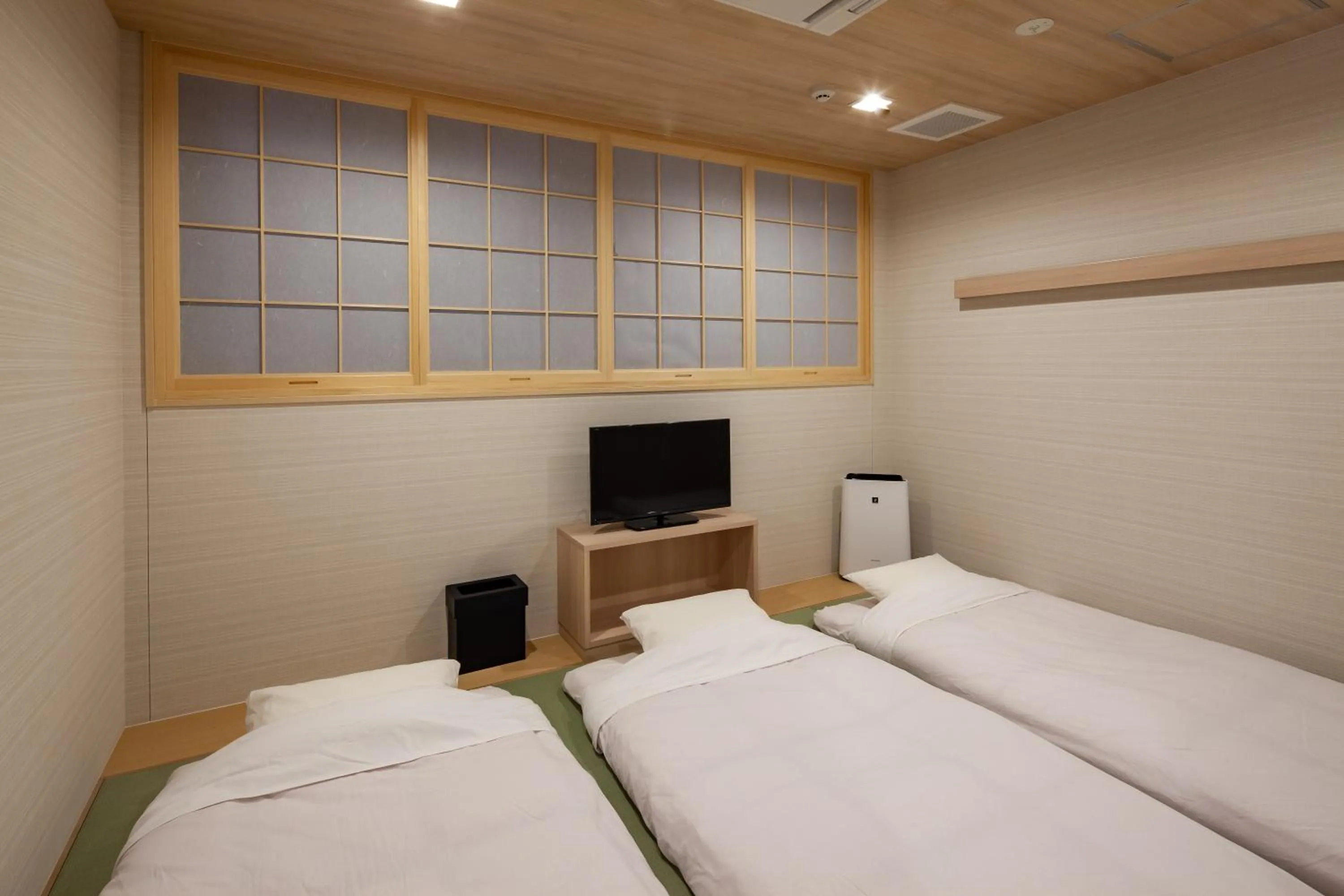 Photo of the whole room, Bed in Y's CABIN&HOTEL Naha Kokusai Street