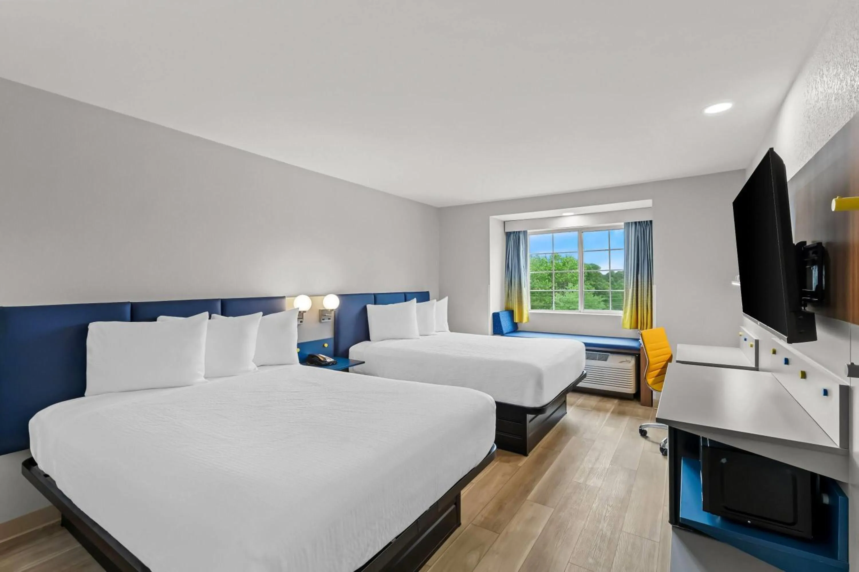 Bed in Microtel Inn & Suites by Wyndham Norcross
