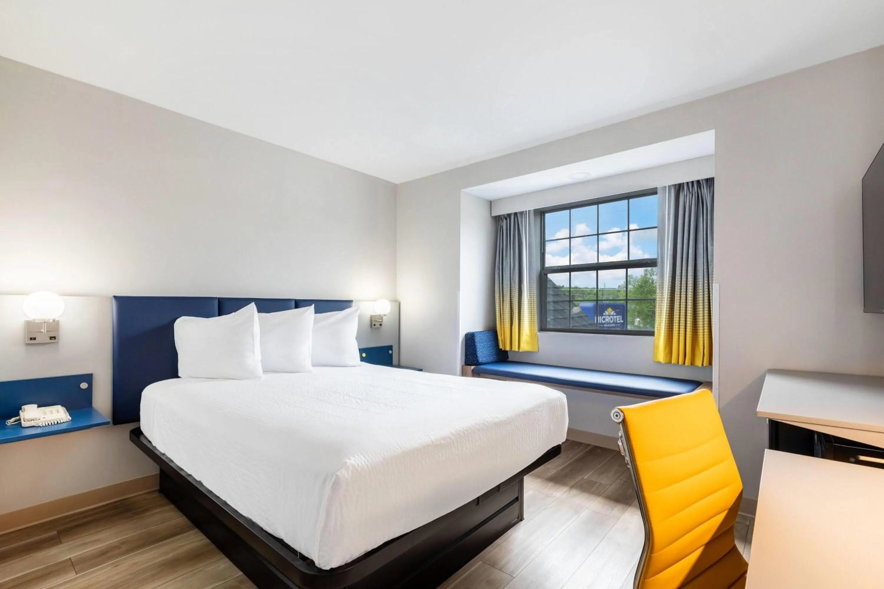 Bed in Microtel Inn & Suites by Wyndham Norcross