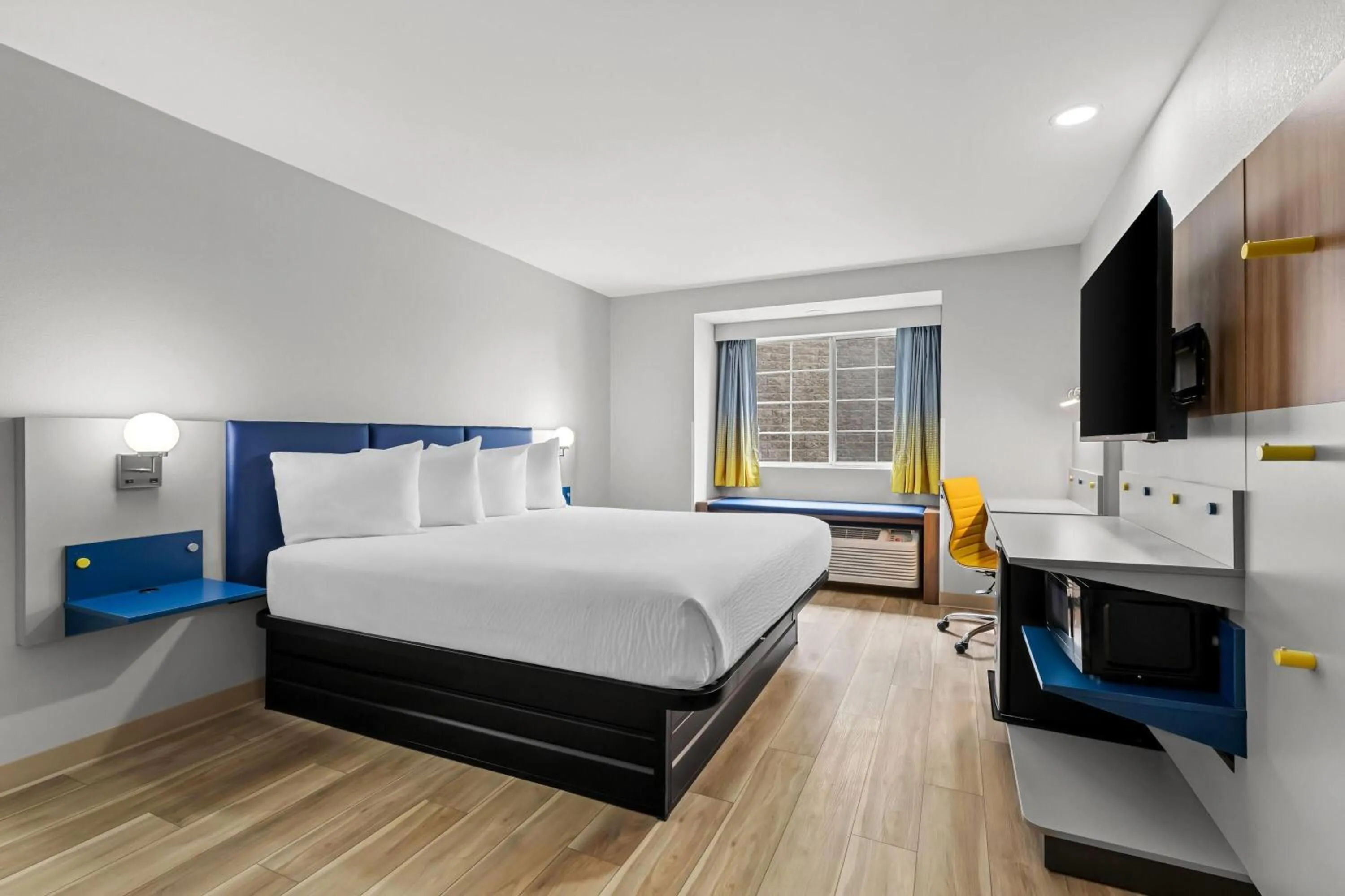 Bed in Microtel Inn & Suites by Wyndham Norcross