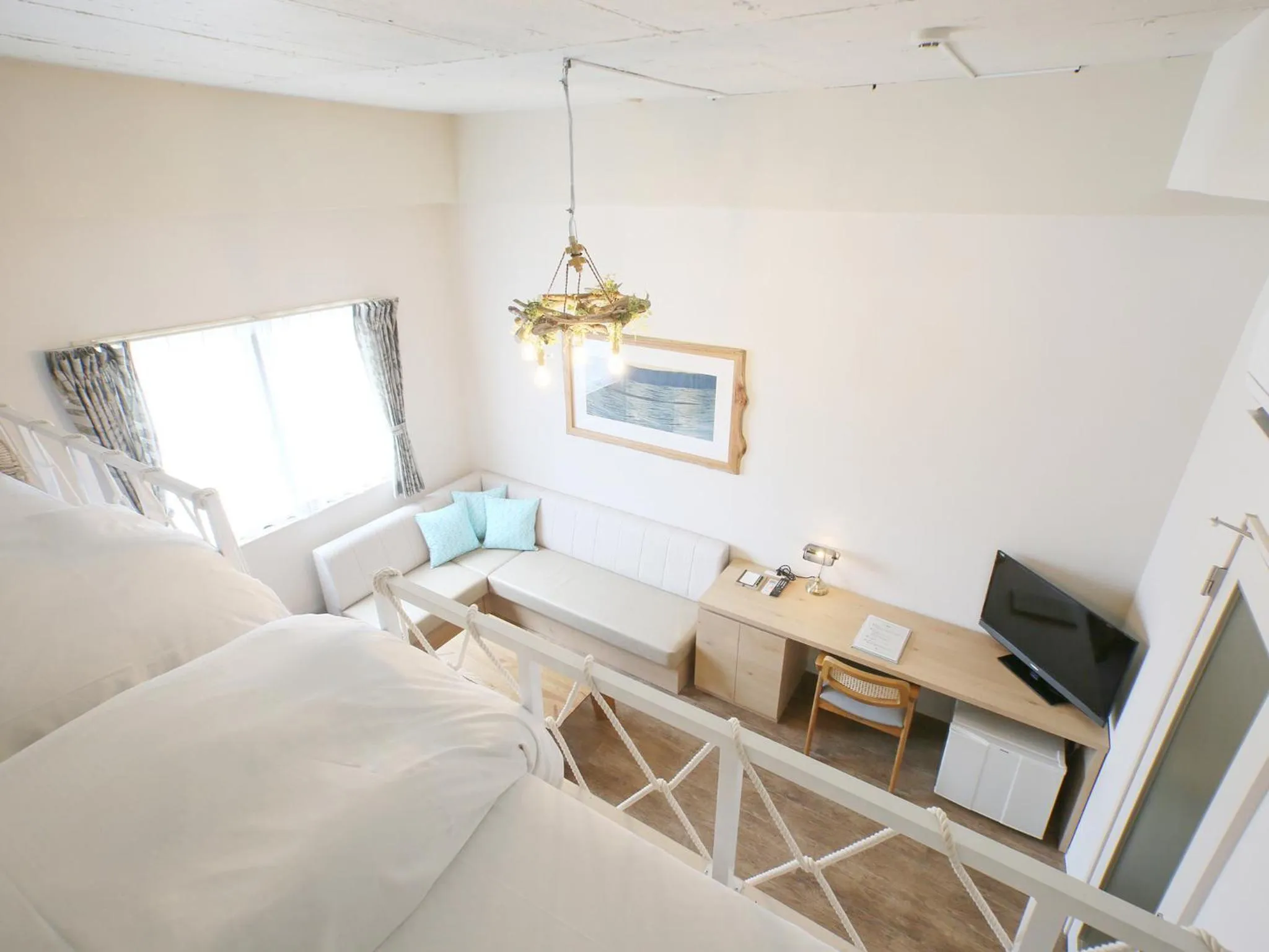 Photo of the whole room, Bed in Ishigakijima Hotel Cucule