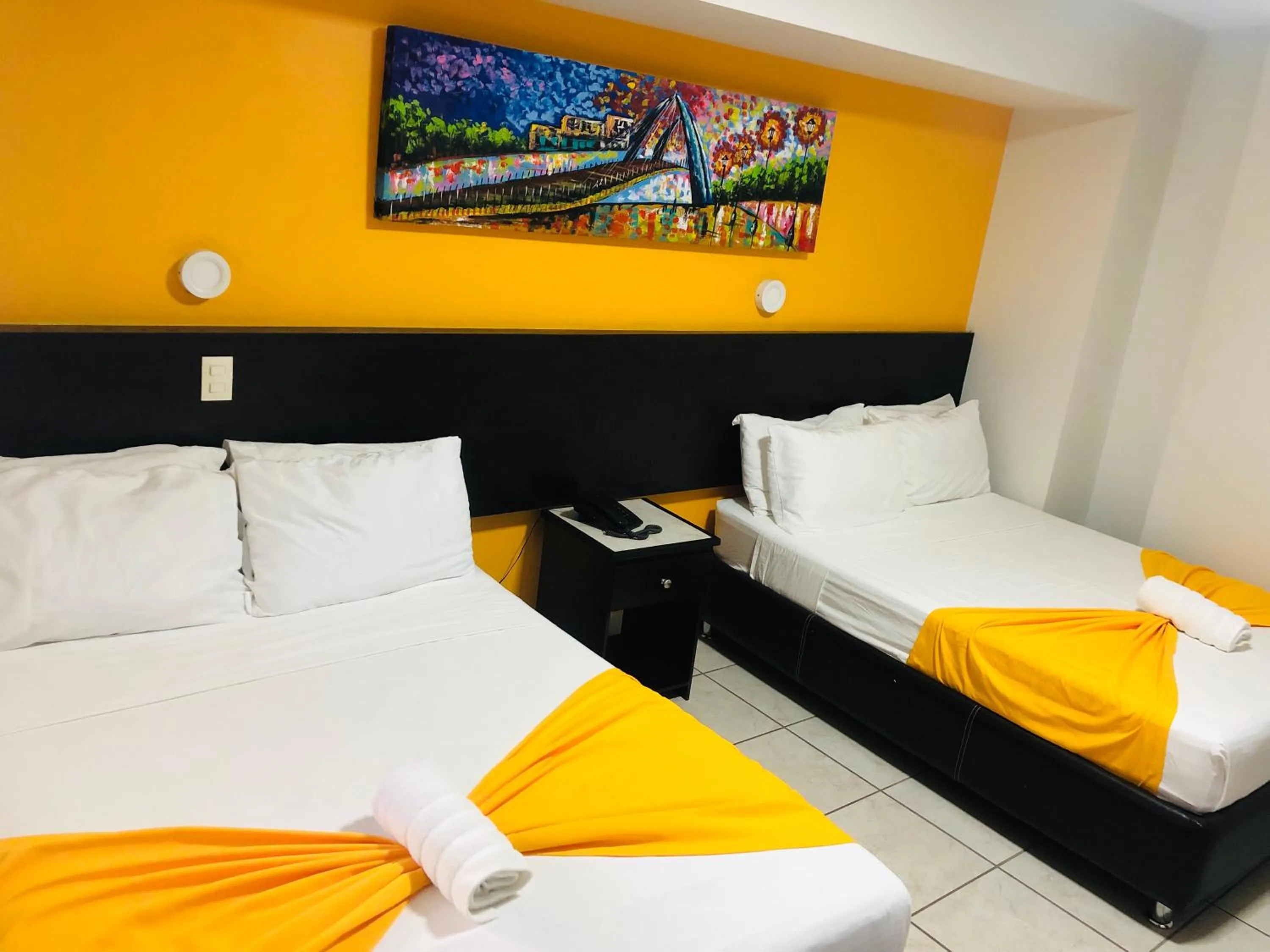 Bed in Hotel Belisario INN