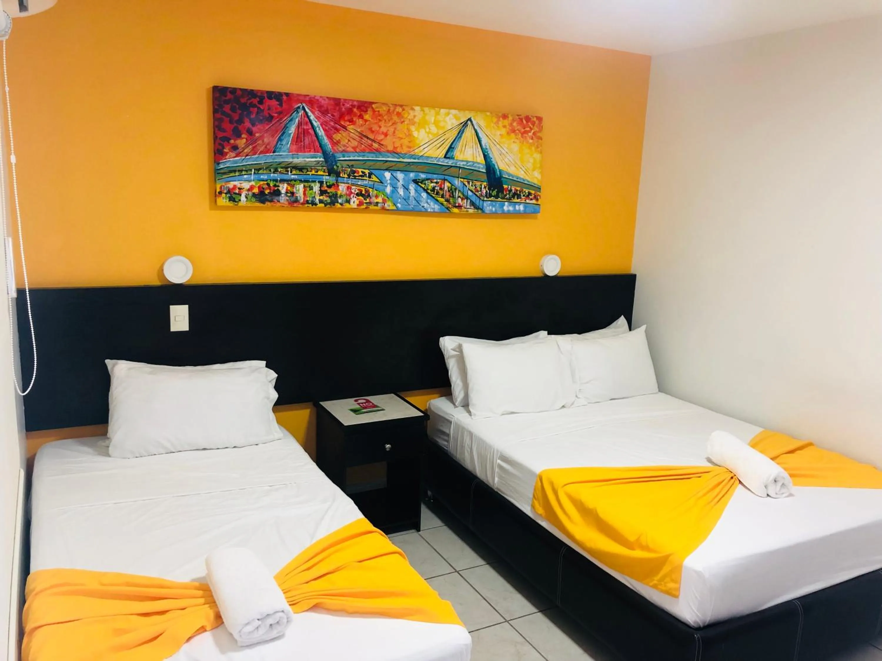 Bed in Hotel Belisario INN
