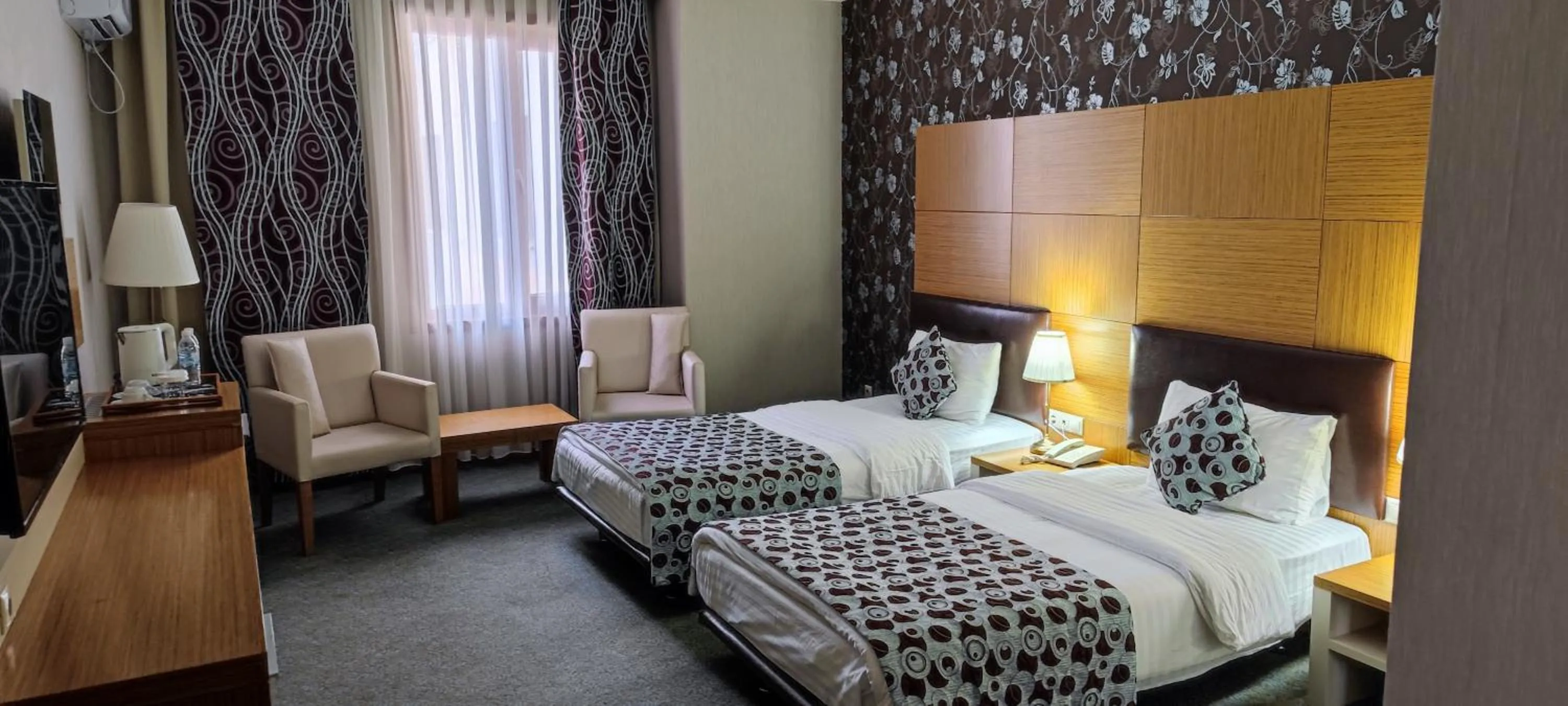 Bed in Grand Nur Plaza Hotel