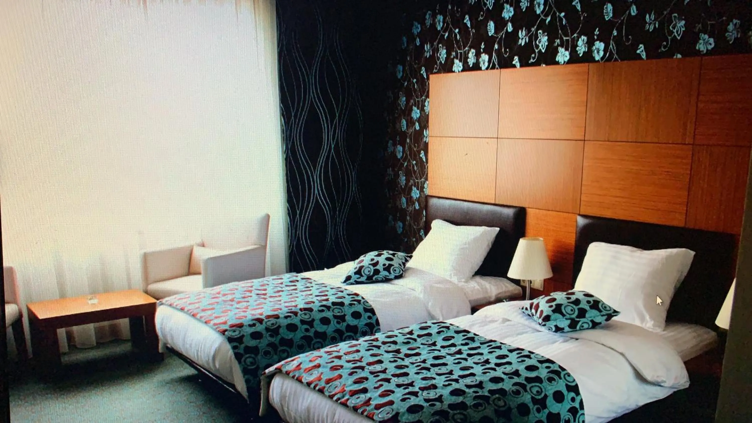 Bed in Grand Nur Plaza Hotel