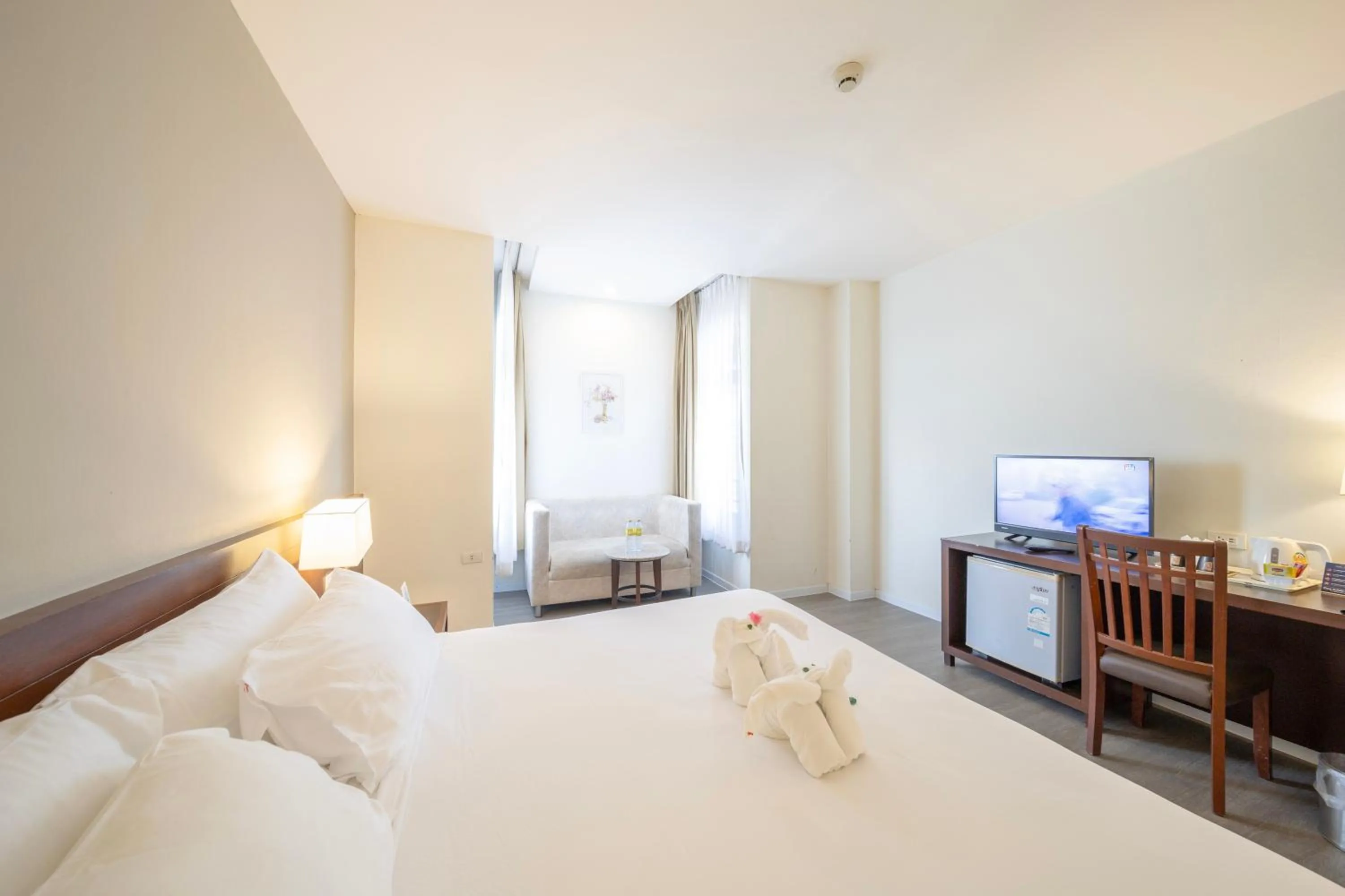 Bed in Golden Crown Grand Hotel