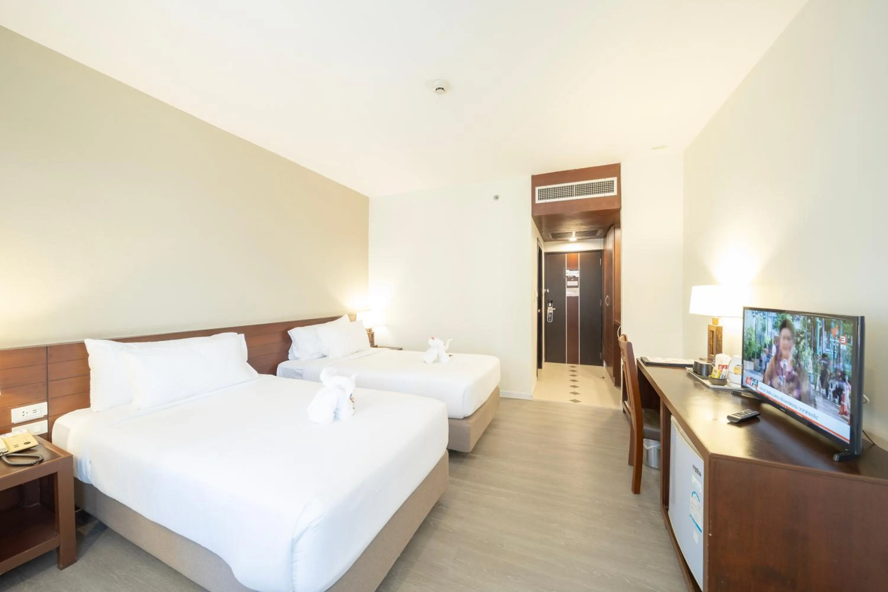 Bed in Golden Crown Grand Hotel