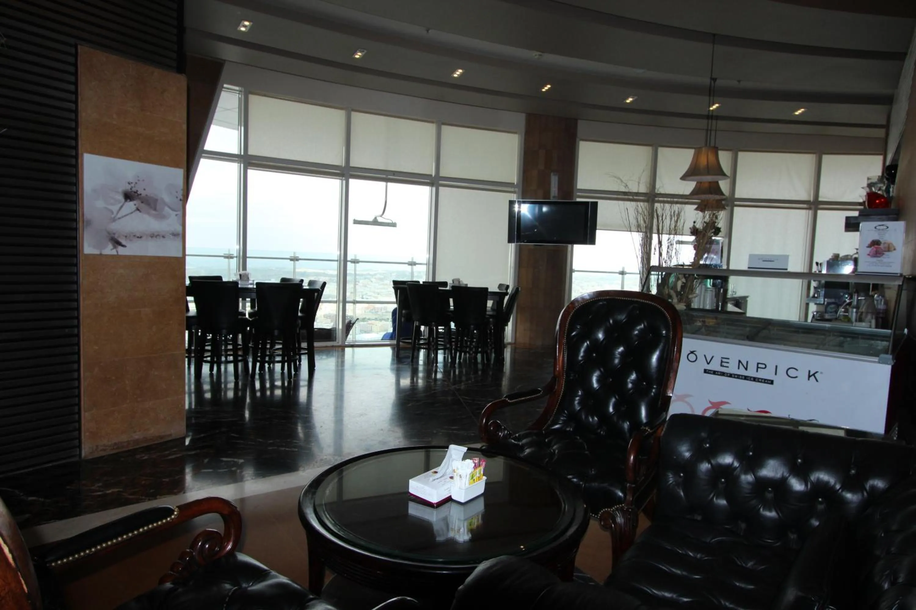 Communal lounge/ TV room in Awaliv Hotel