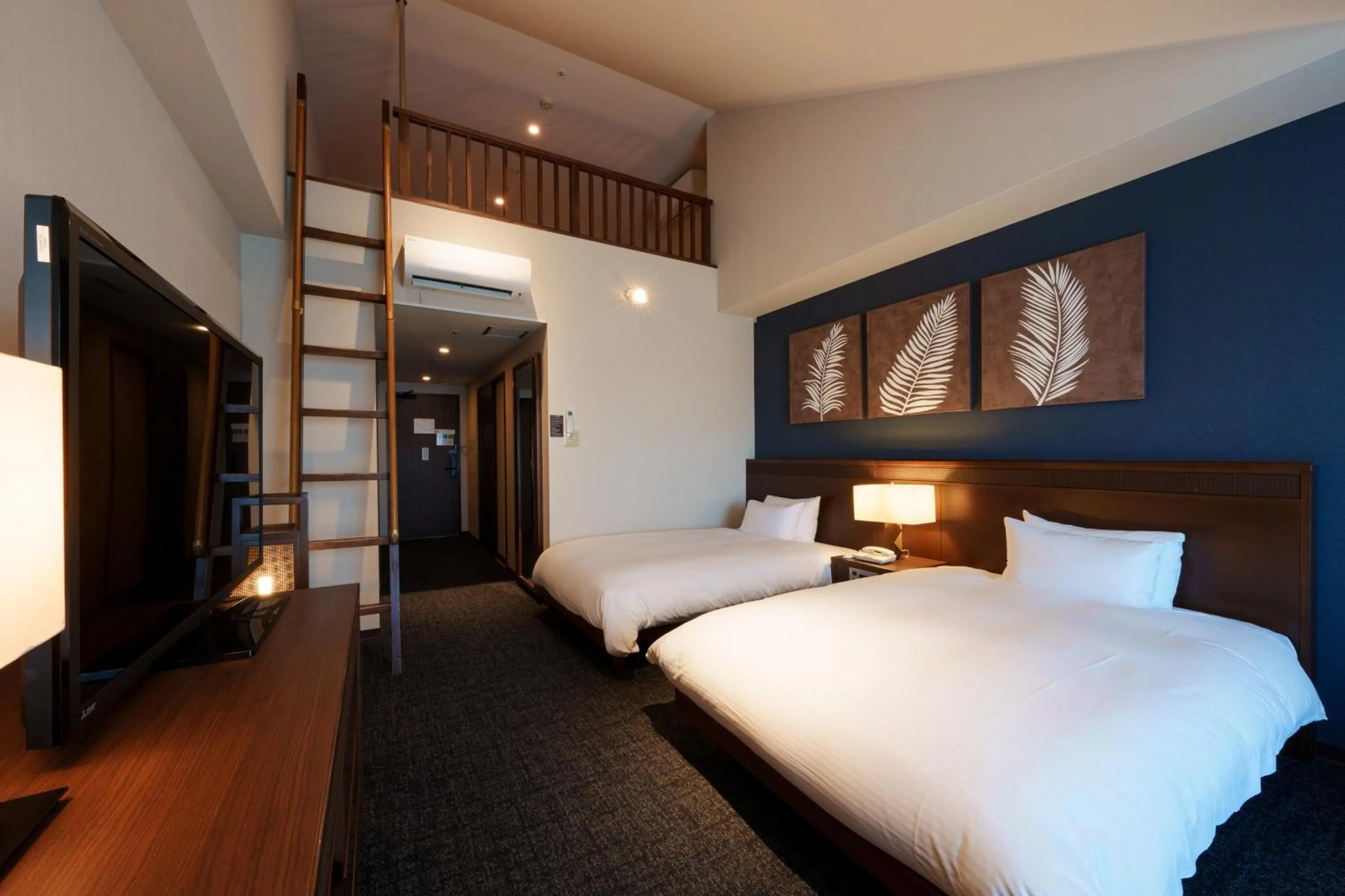 Bed in GRANDVRIORESORT ISHIGAKIJIMA Ocean's Wing & Villa Garden