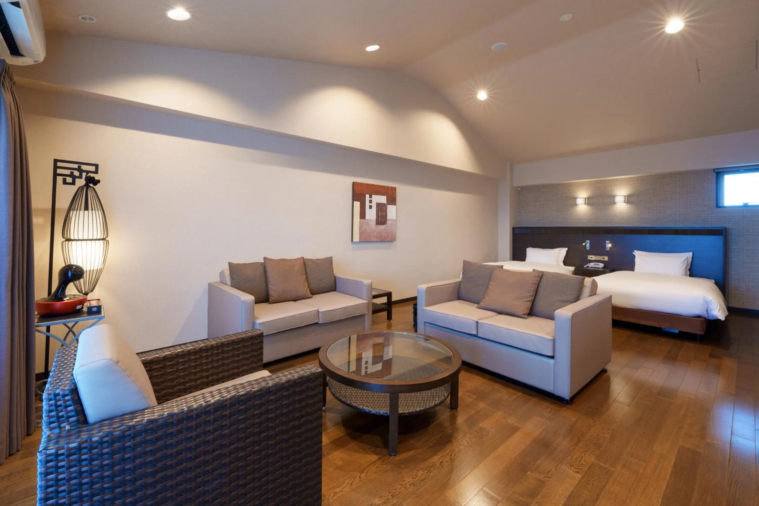 Bed in GRANDVRIORESORT ISHIGAKIJIMA Ocean's Wing & Villa Garden