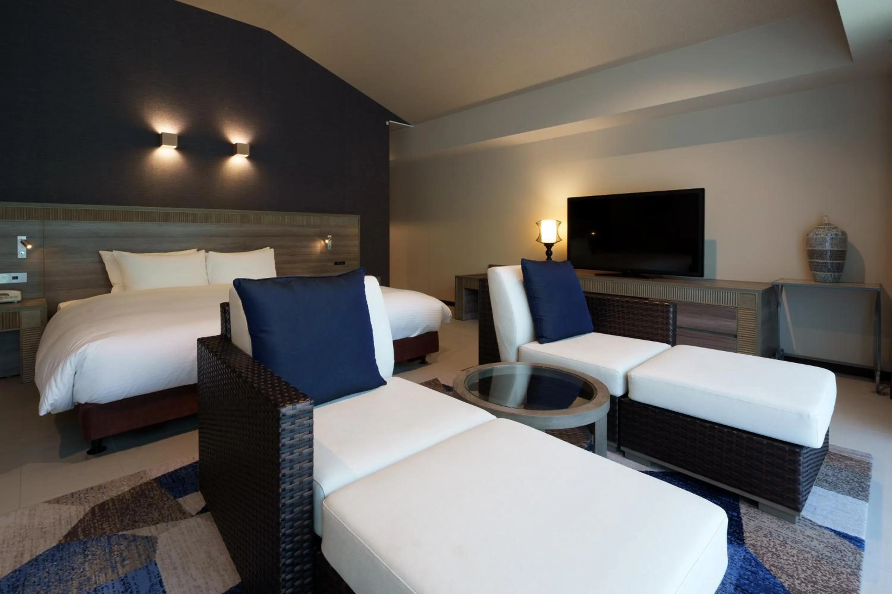 Bed in GRANDVRIORESORT ISHIGAKIJIMA Ocean's Wing & Villa Garden