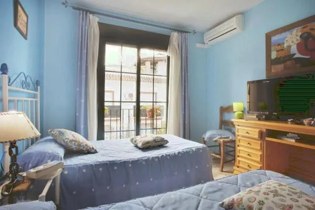 Photo of the whole room, Bed in Hospederia V Centenario