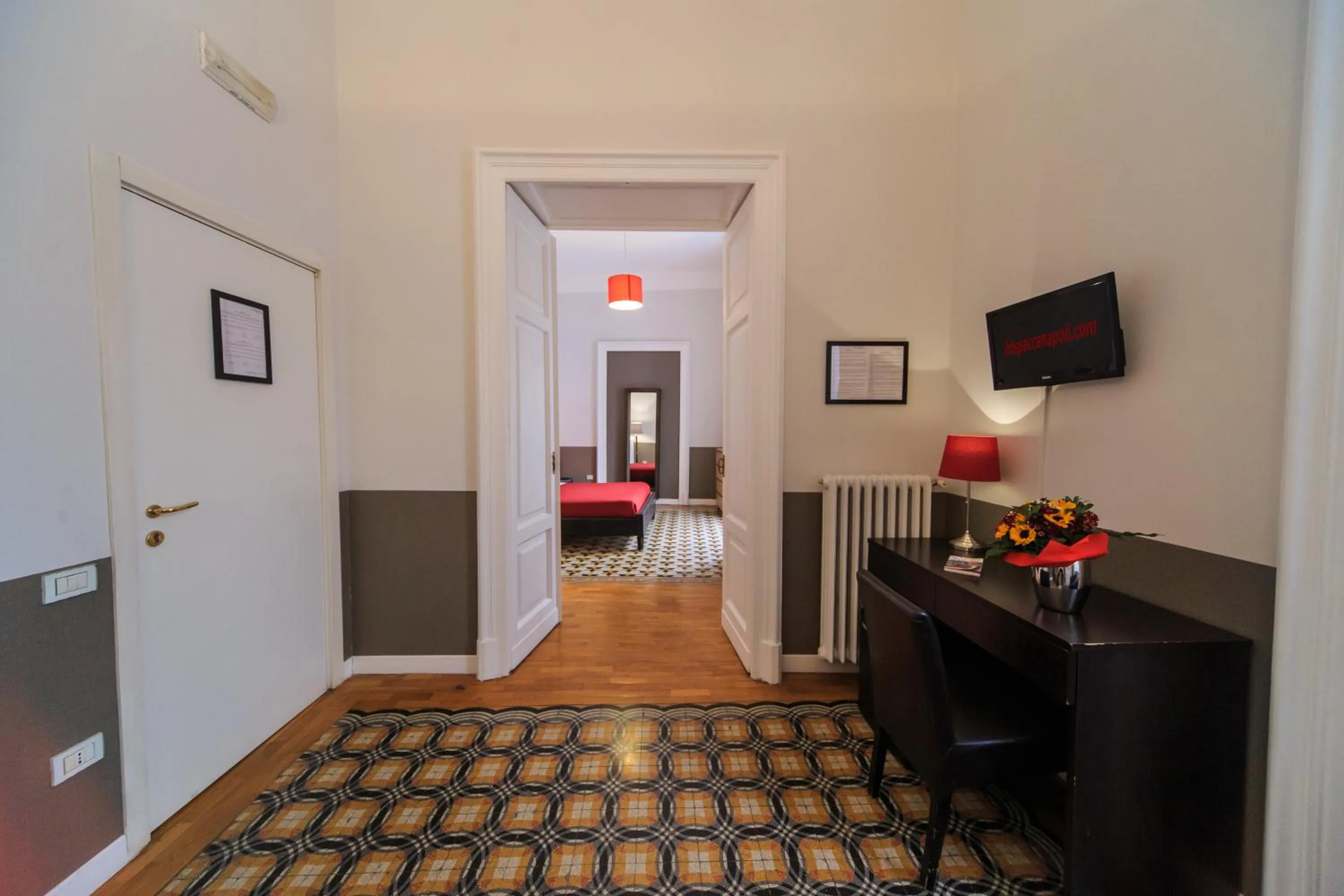 Living room, Bed in Spaccanapoli Comfort Suites