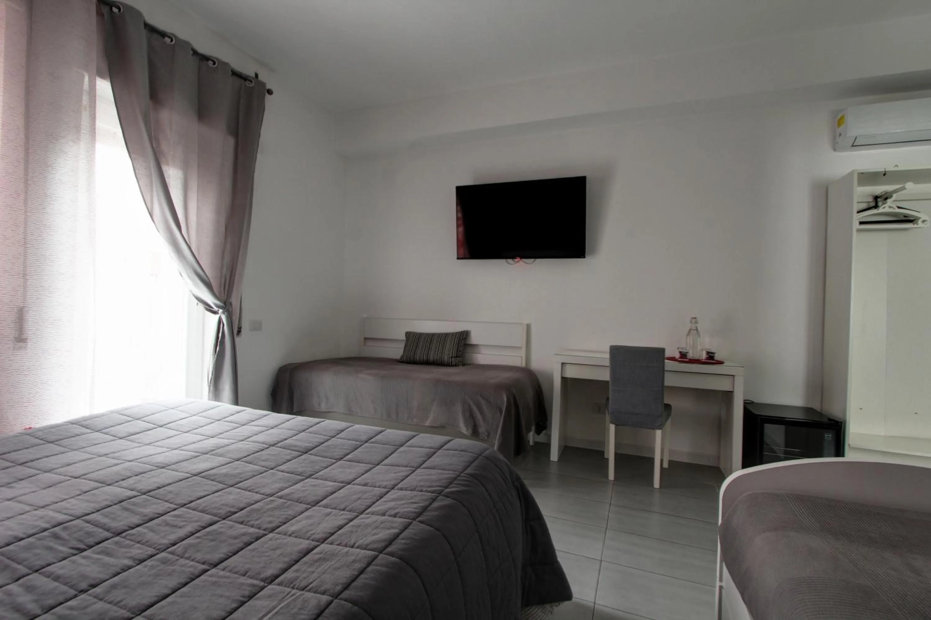 Bed in Vatican Central Suites