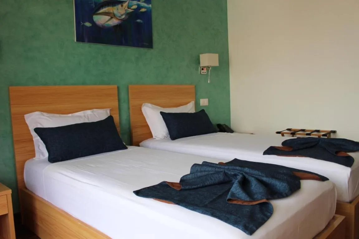 Bed in Blue Marlin Hotel