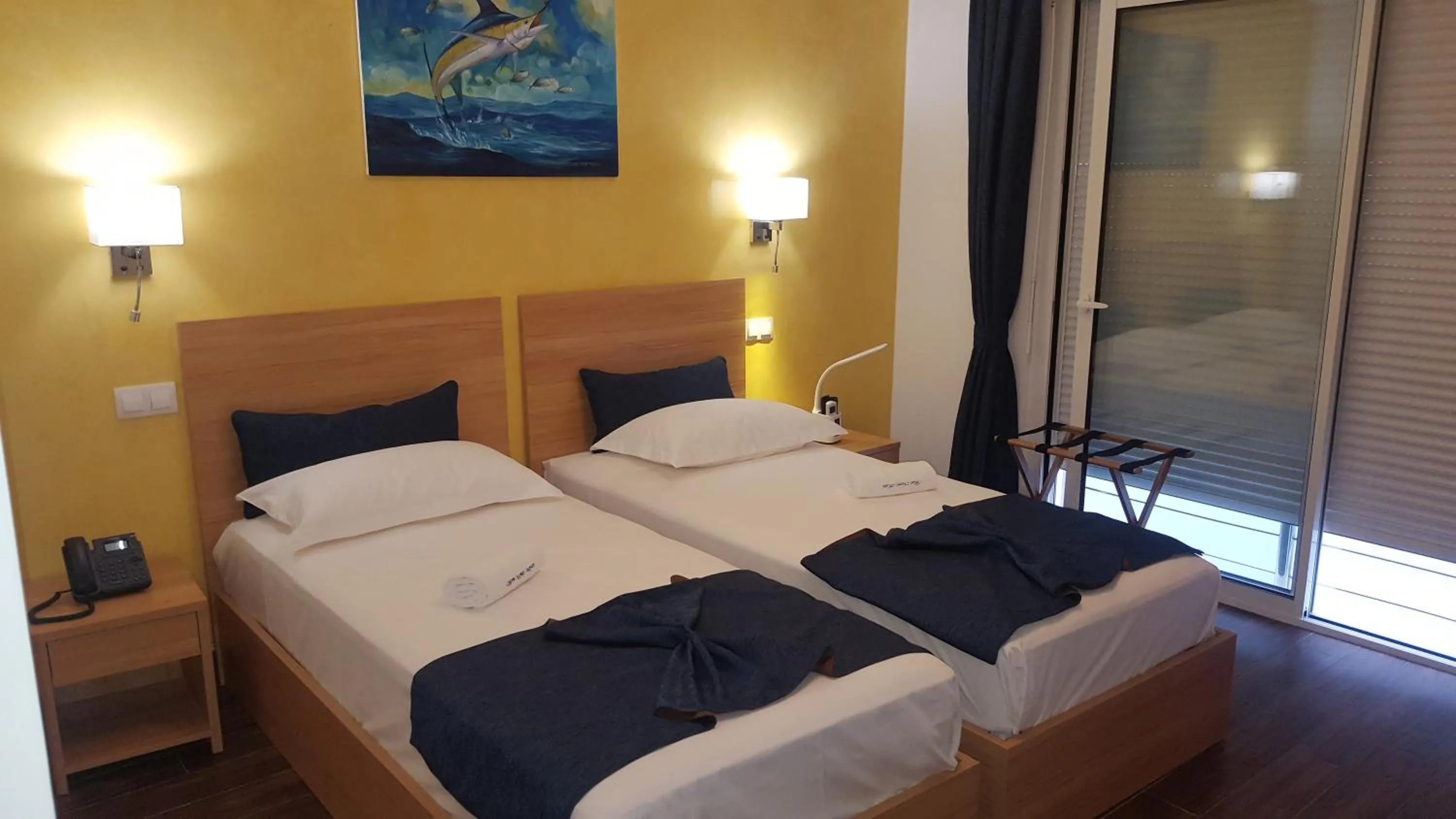Bed in Blue Marlin Hotel