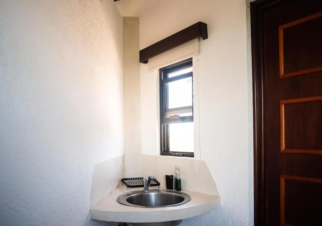 Kitchen or kitchenette in Villa Los Mangles Boutique Hotel