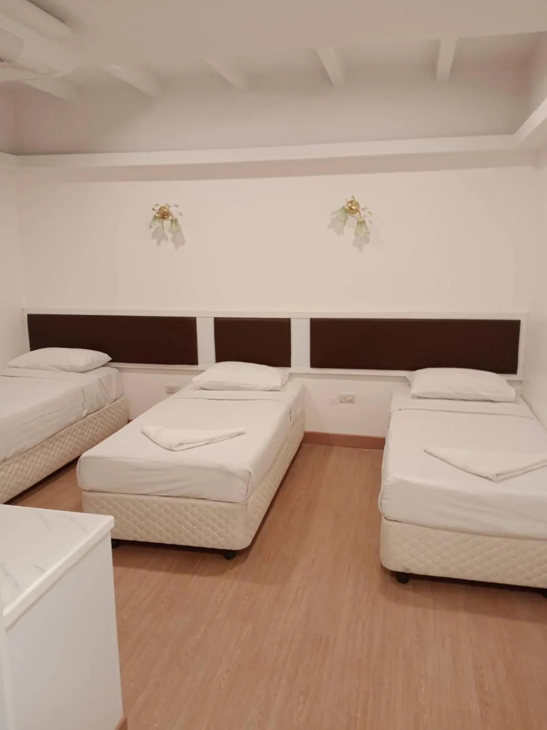 Bed in Royal Garden Home Hotel