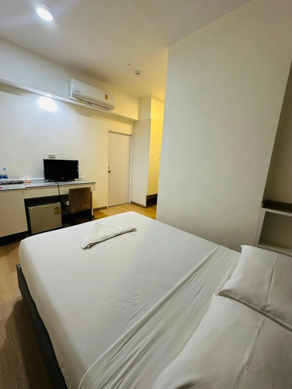 Bed in Royal Garden Home Hotel