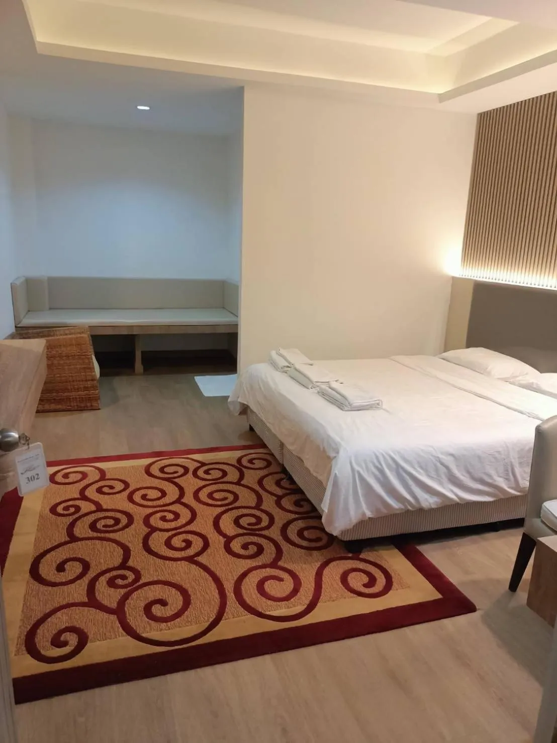 Bed in Royal Garden Home Hotel