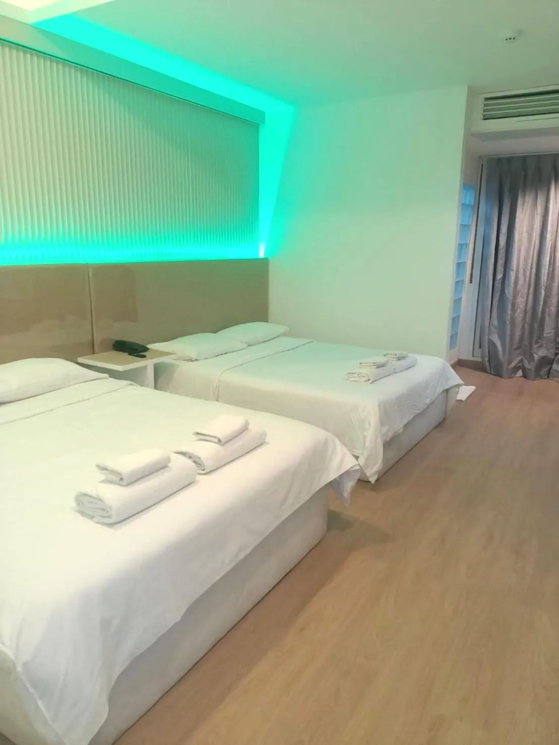 Bed in Royal Garden Home Hotel