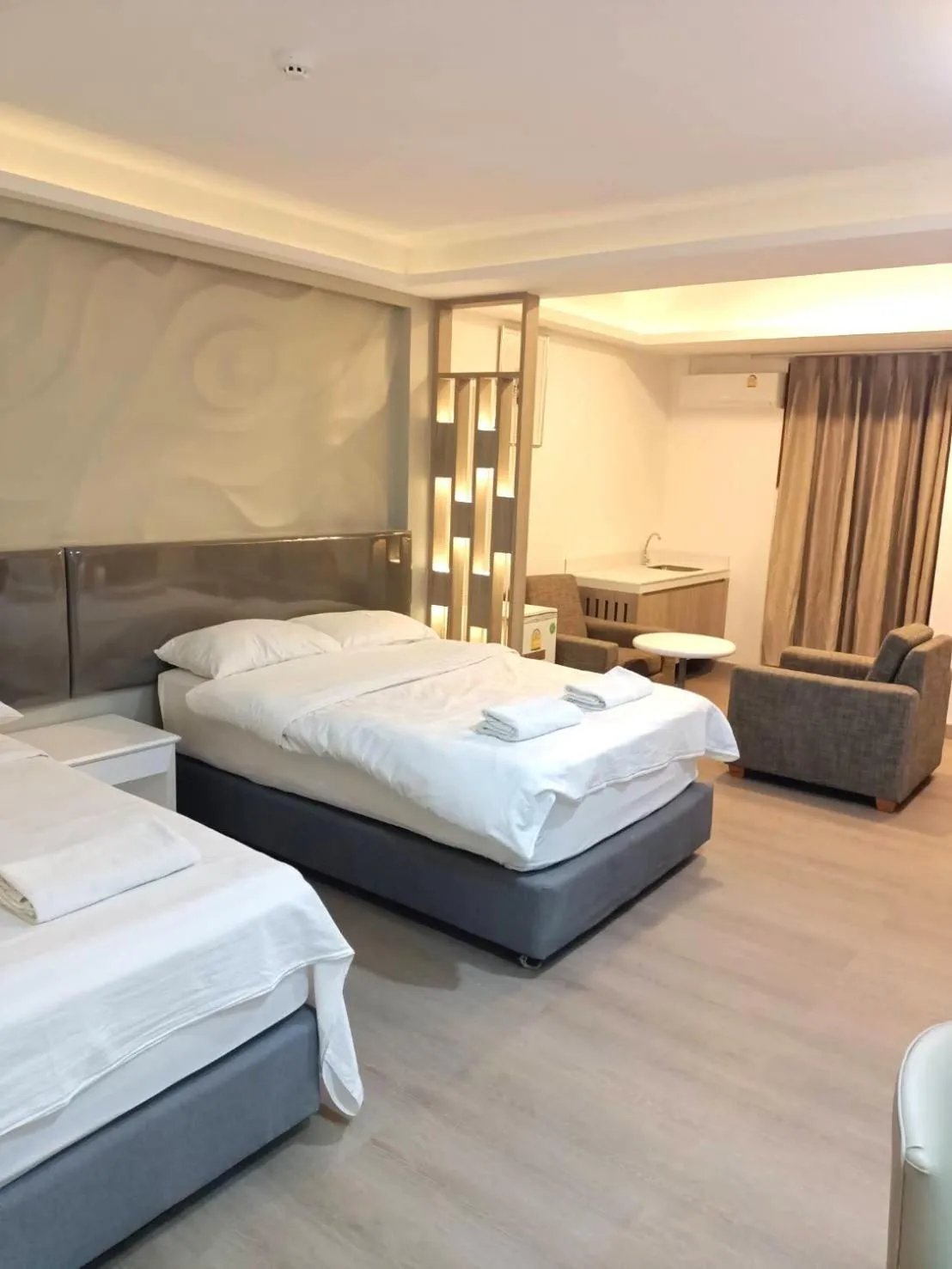 Bed in Royal Garden Home Hotel