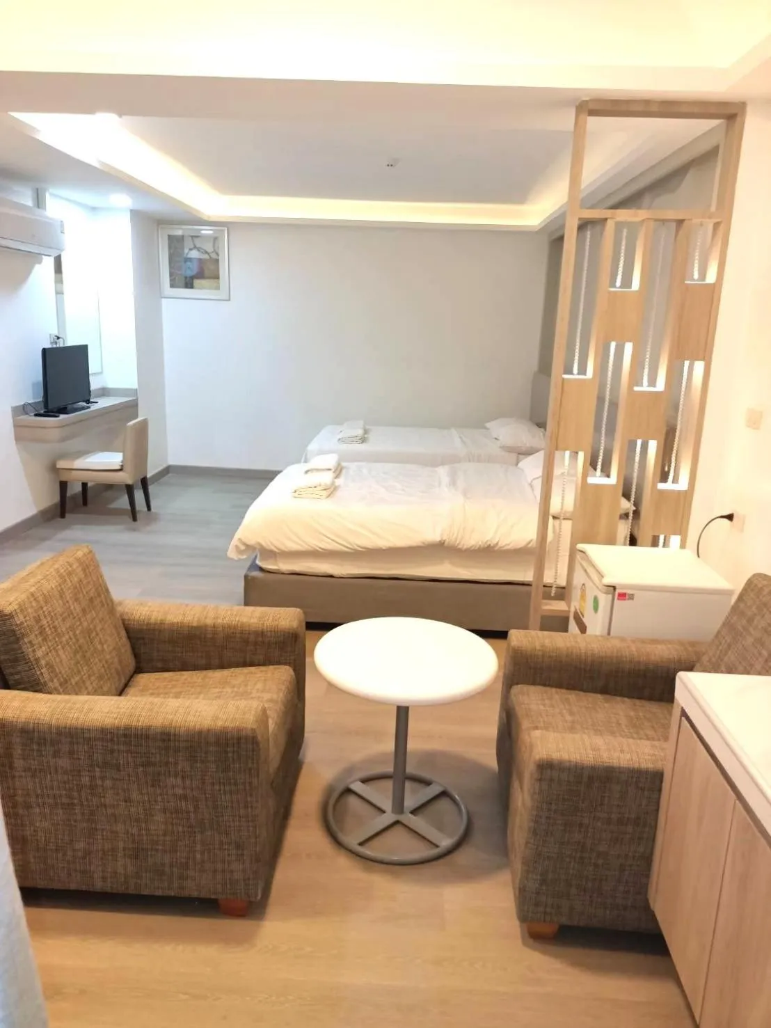 Bed in Royal Garden Home Hotel