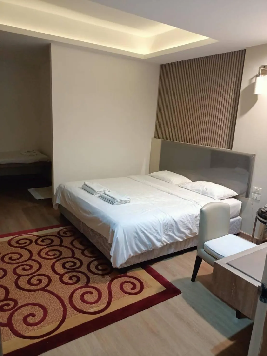 Bed in Royal Garden Home Hotel