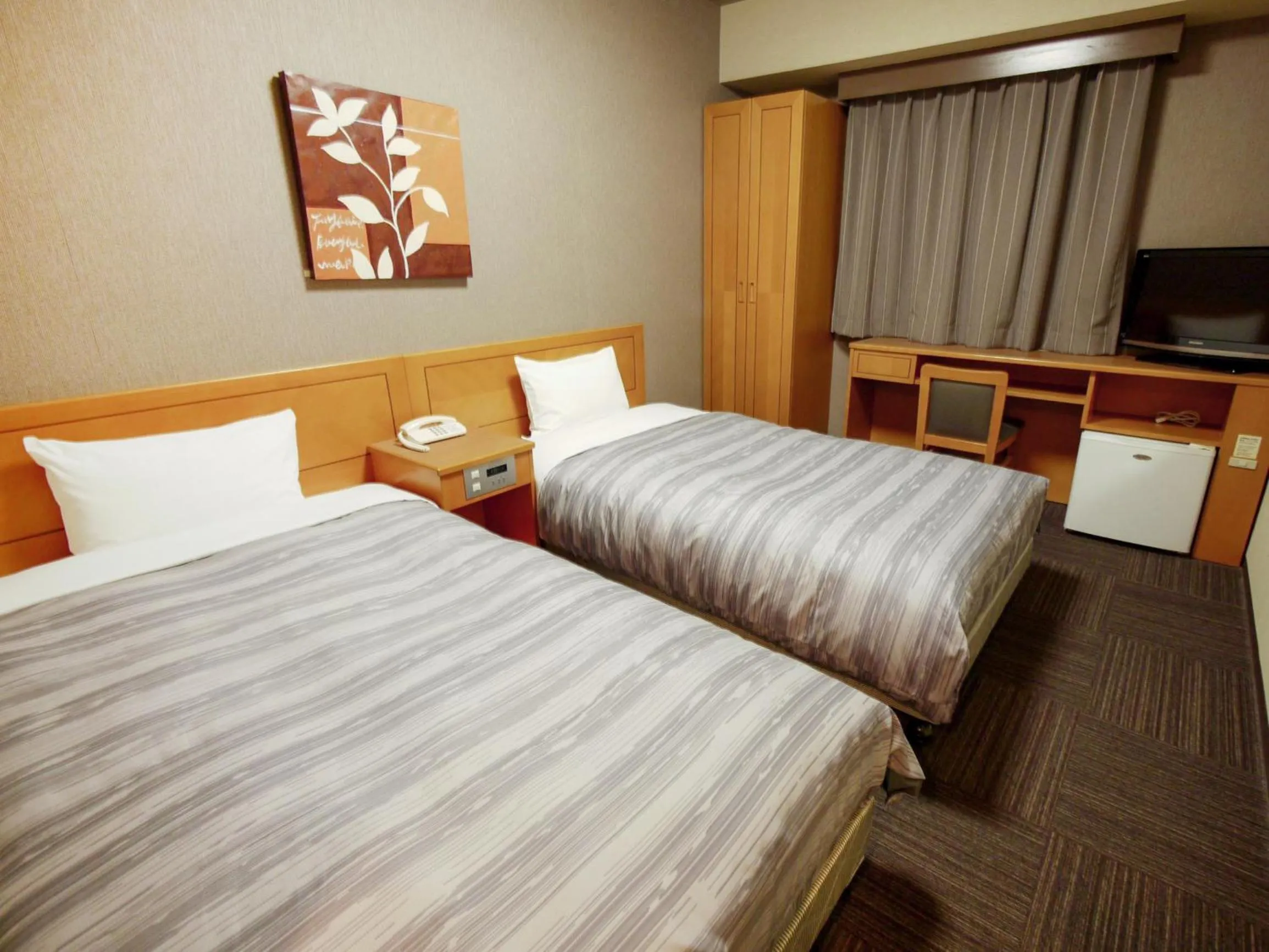 Photo of the whole room, Bed in Hotel Route-Inn Osaka Honmachi