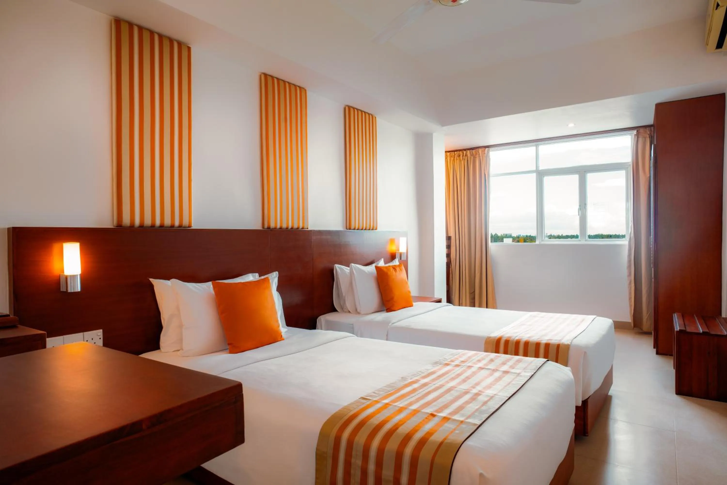 Bed in Camelot Beach Hotel