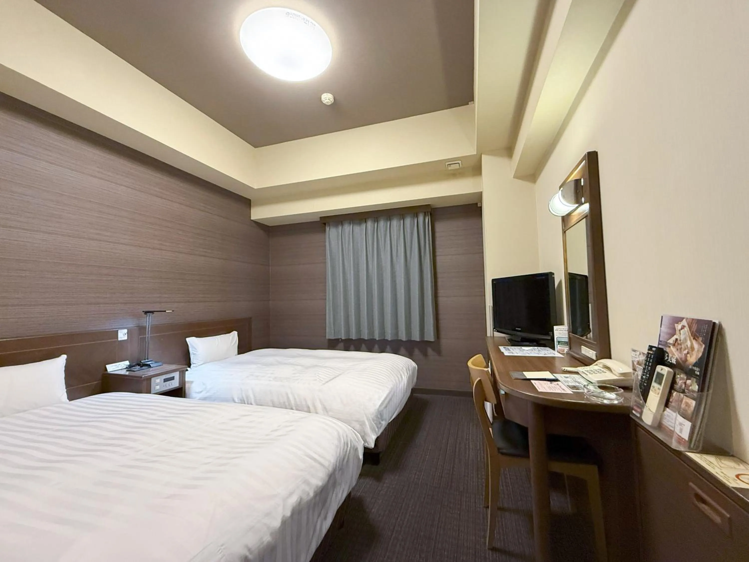 Photo of the whole room, Bed in Hotel Route-Inn Hakata Ekimae -Hakataguchi-