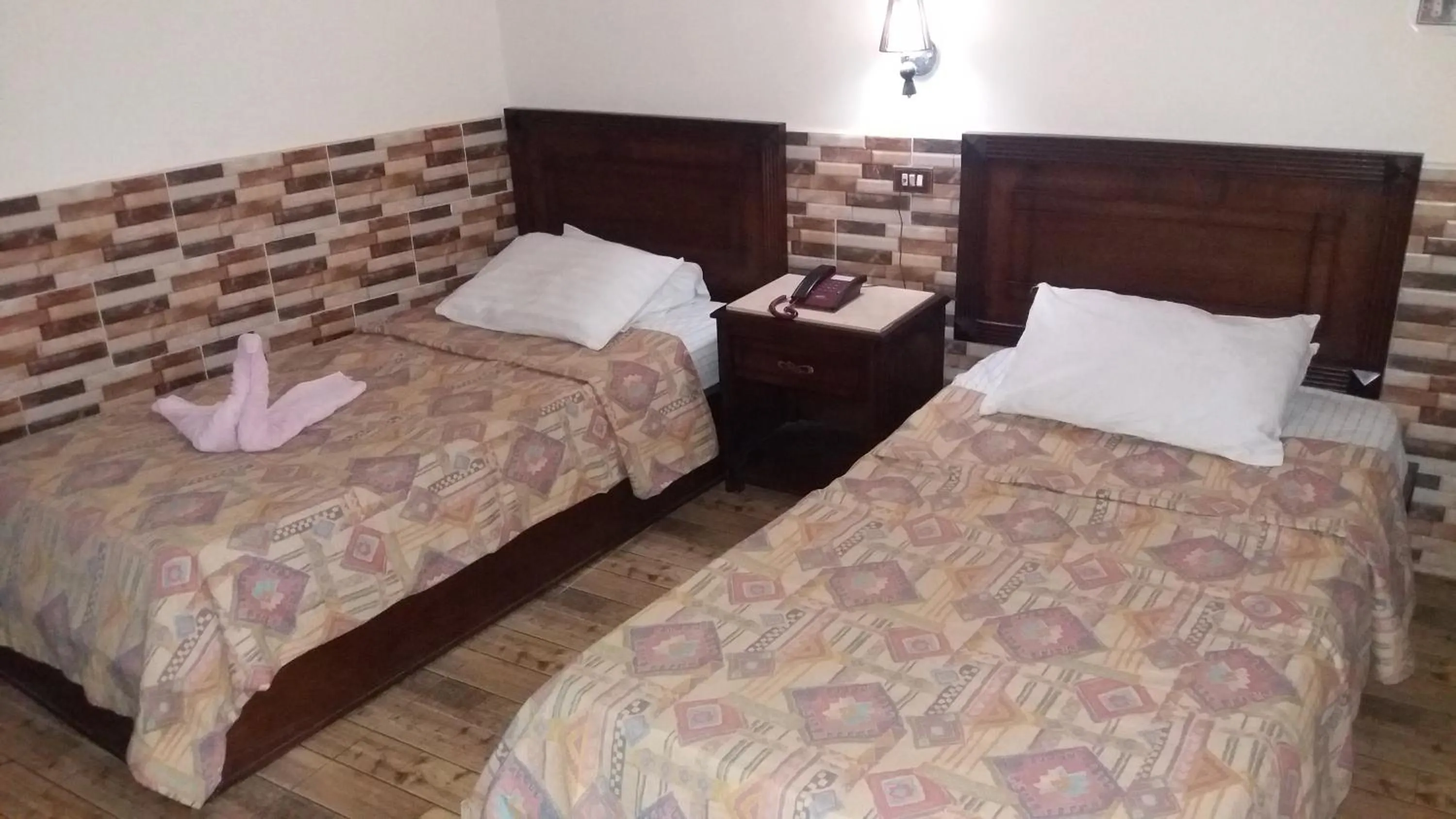 Bed in Ciao Hotel Cairo