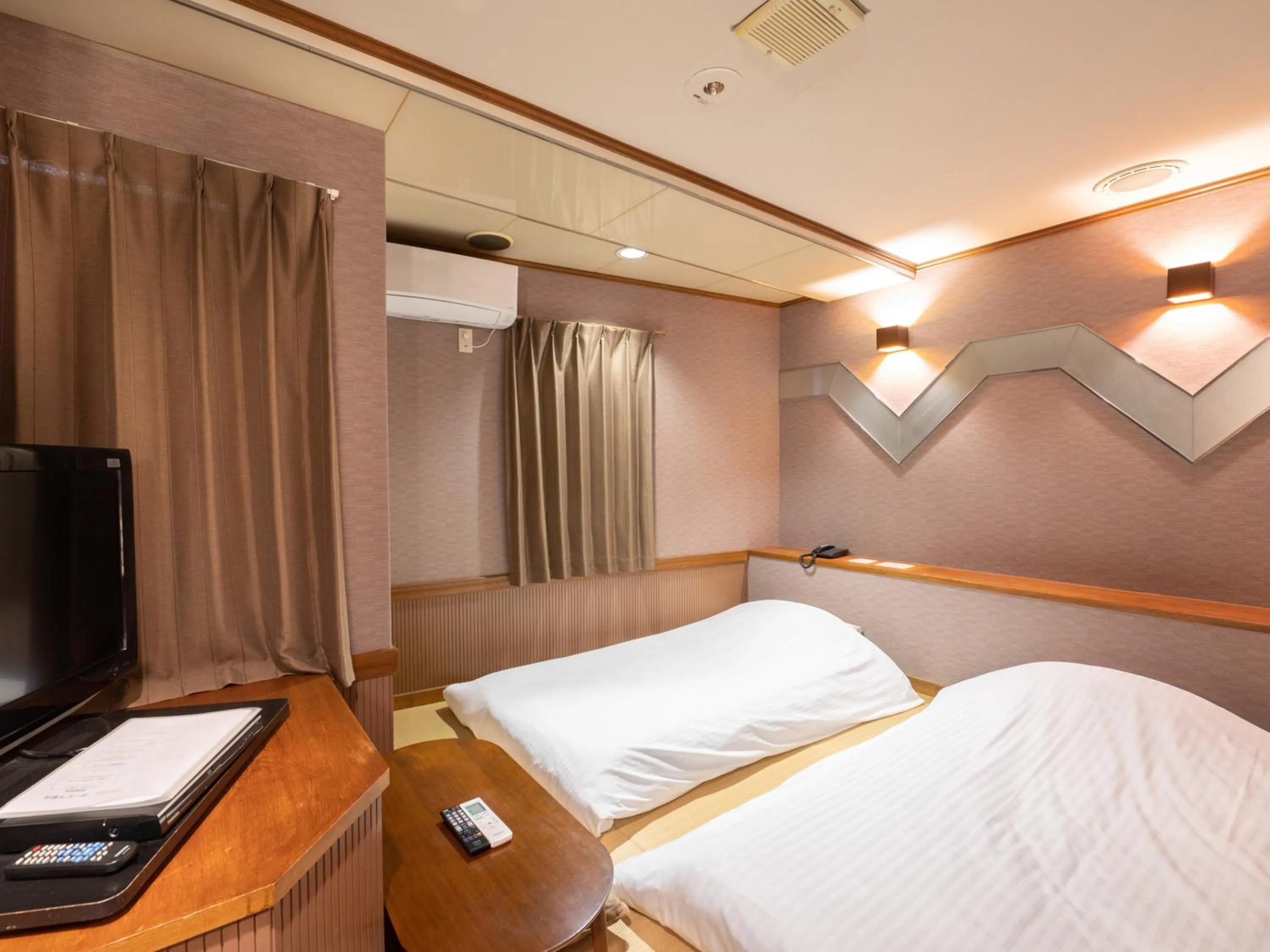 Communal lounge/ TV room, Bed in Tabist Hotel Rakuserina