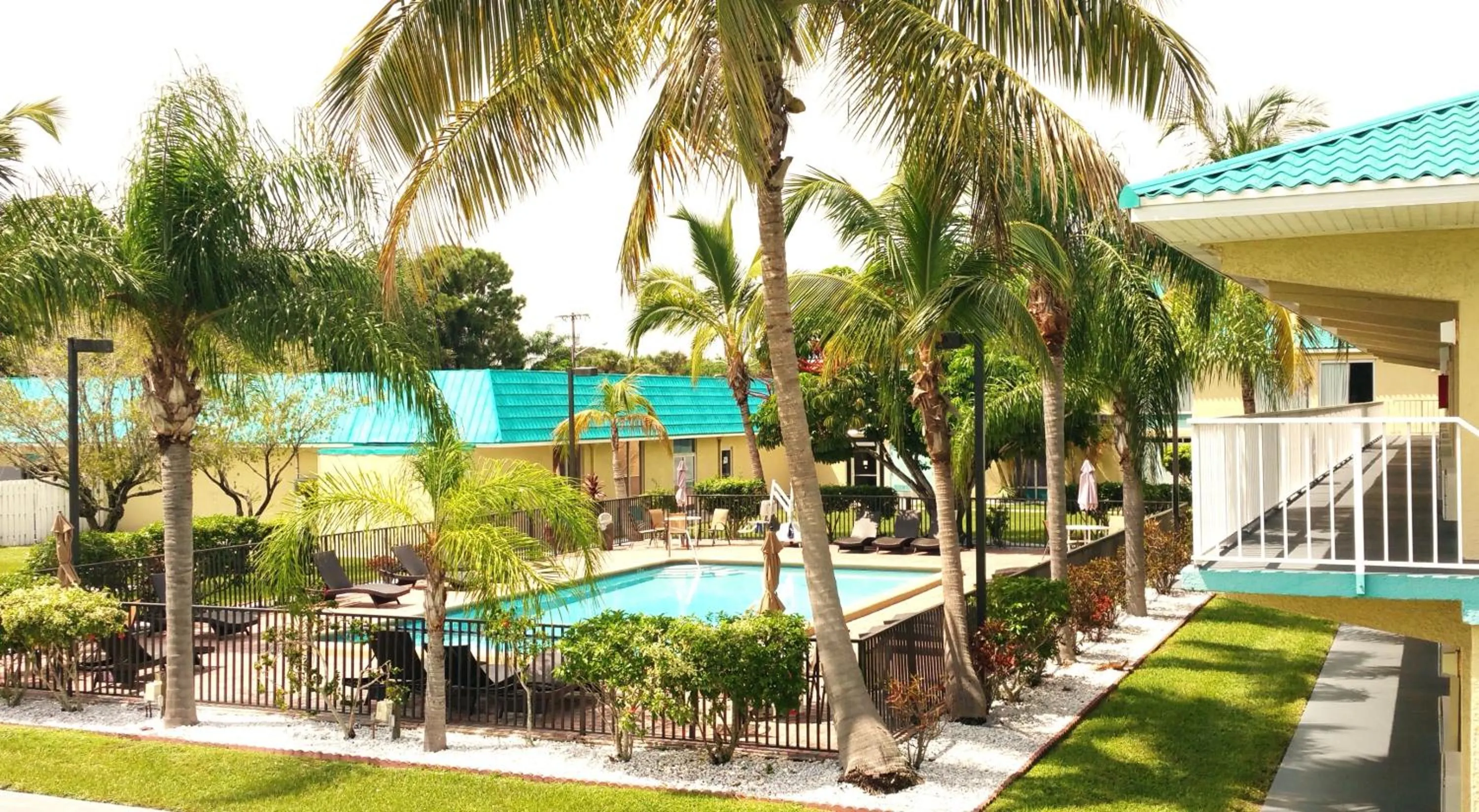 Swimming pool in Days Inn & Suites by Wyndham Fort Pierce Midtown