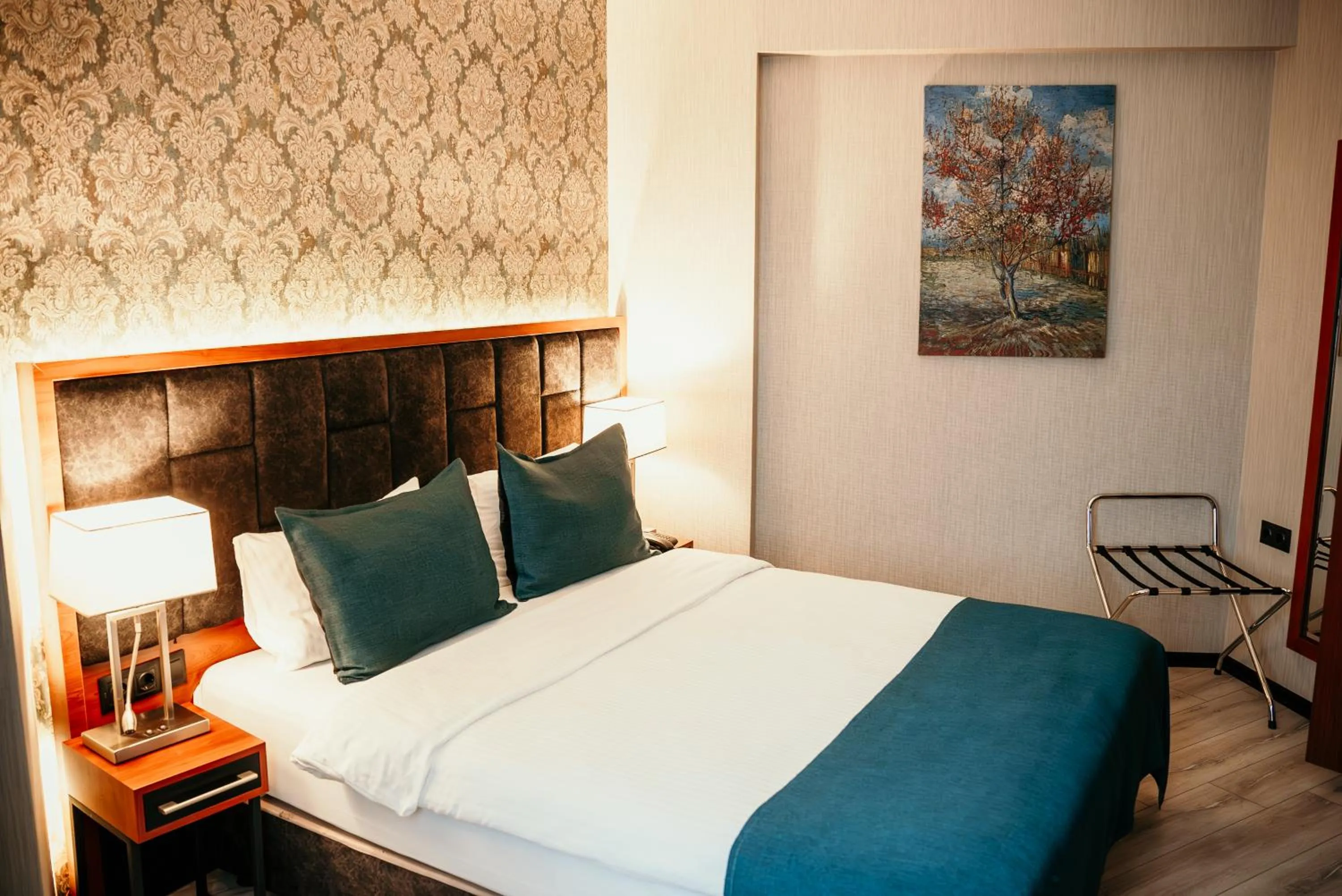 Bed in Grand Vaves Hotel