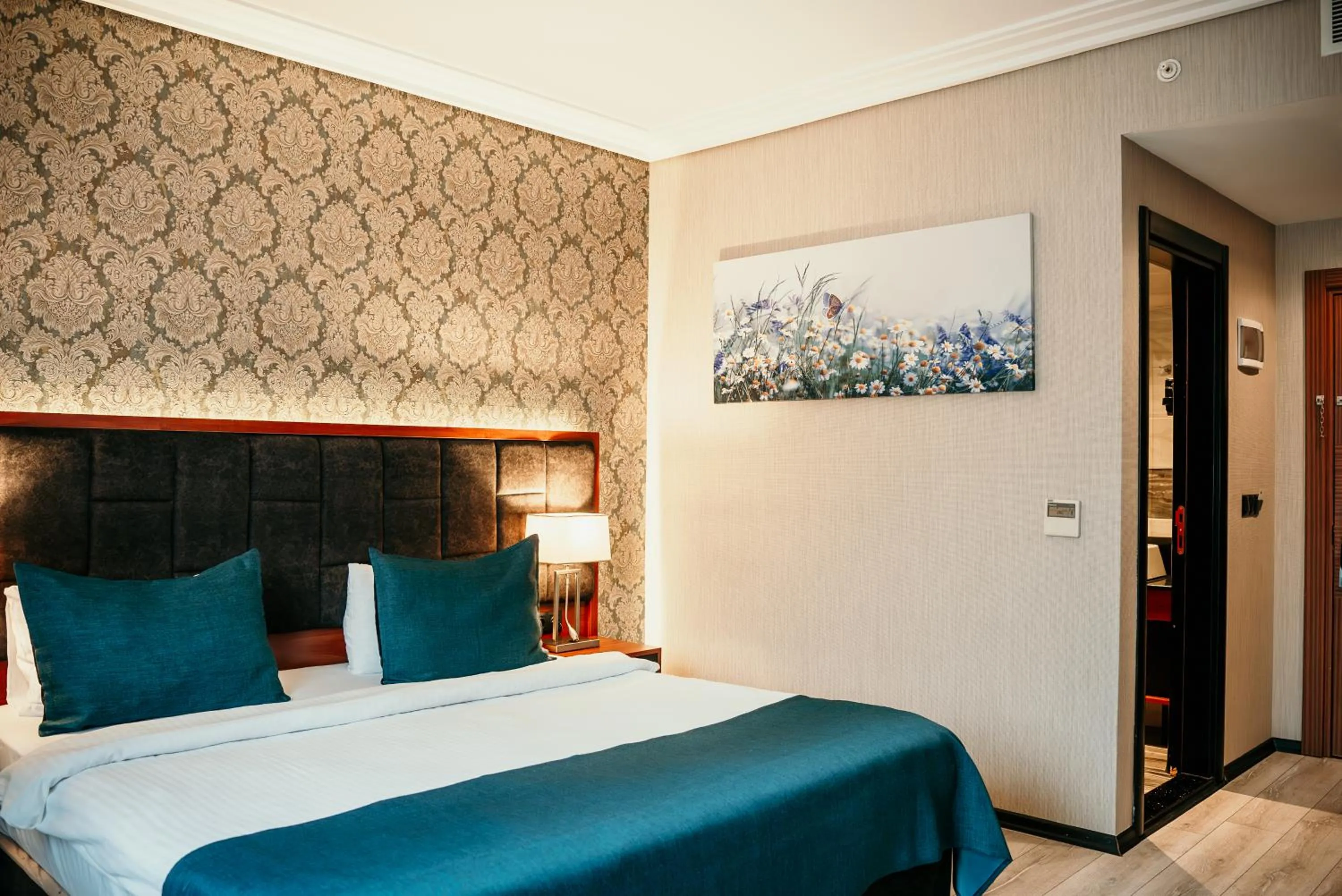 Bed in Grand Vaves Hotel