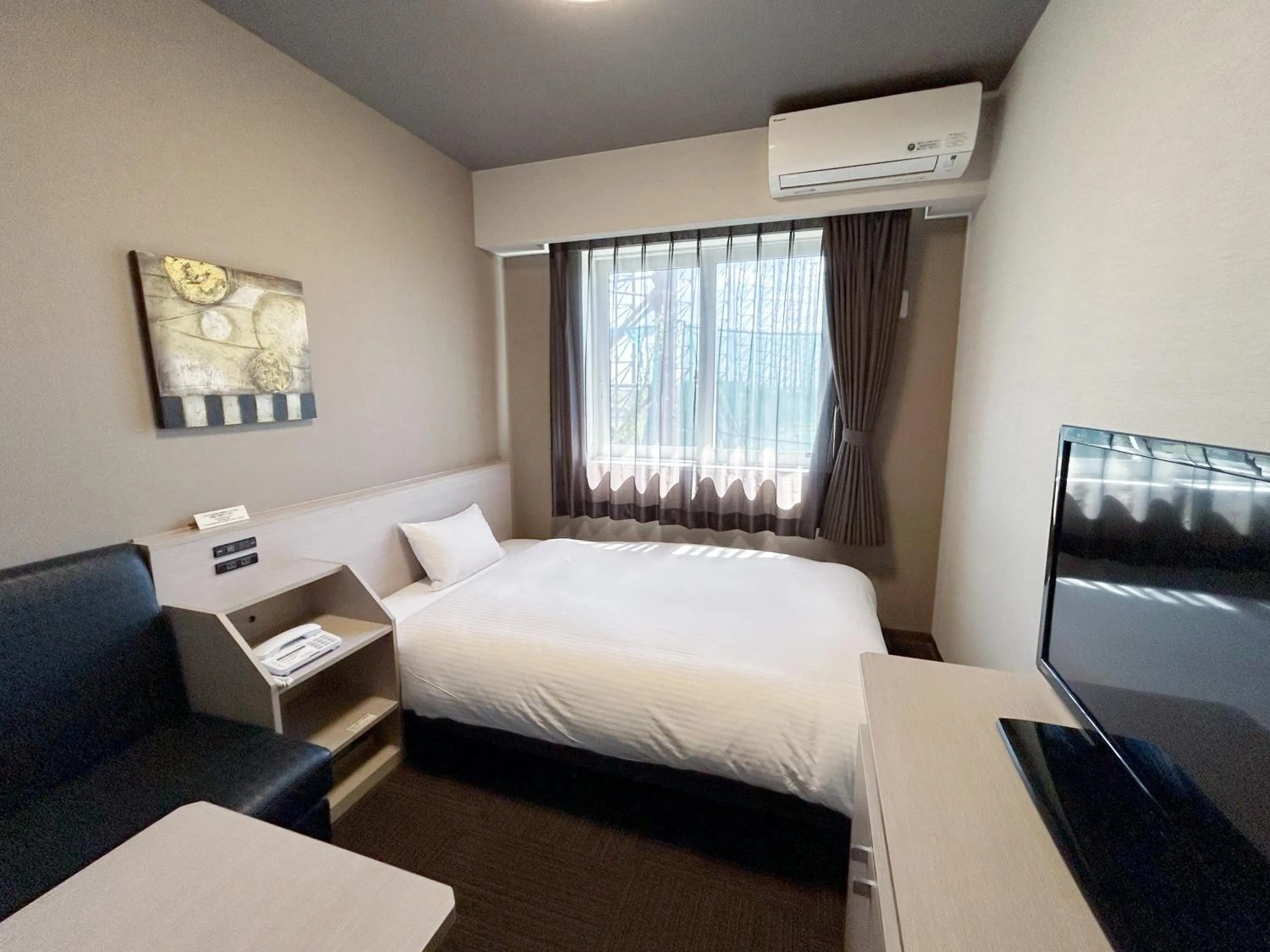 Photo of the whole room, Bed in Route Inn Grantia Komatsu Airport