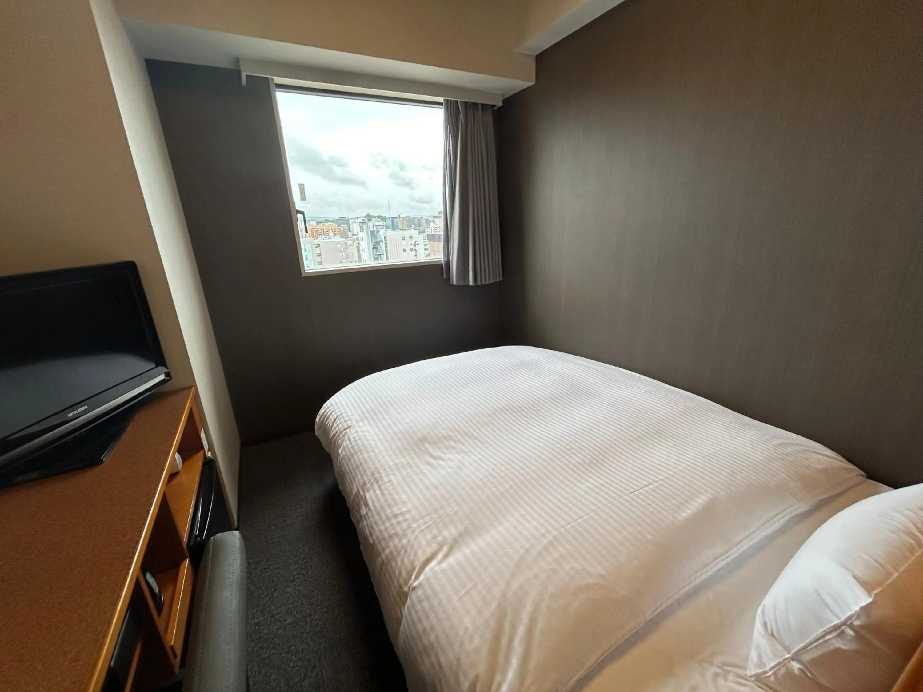 Photo of the whole room, Bed in Hotel Route-Inn Kanazawa Ekimae
