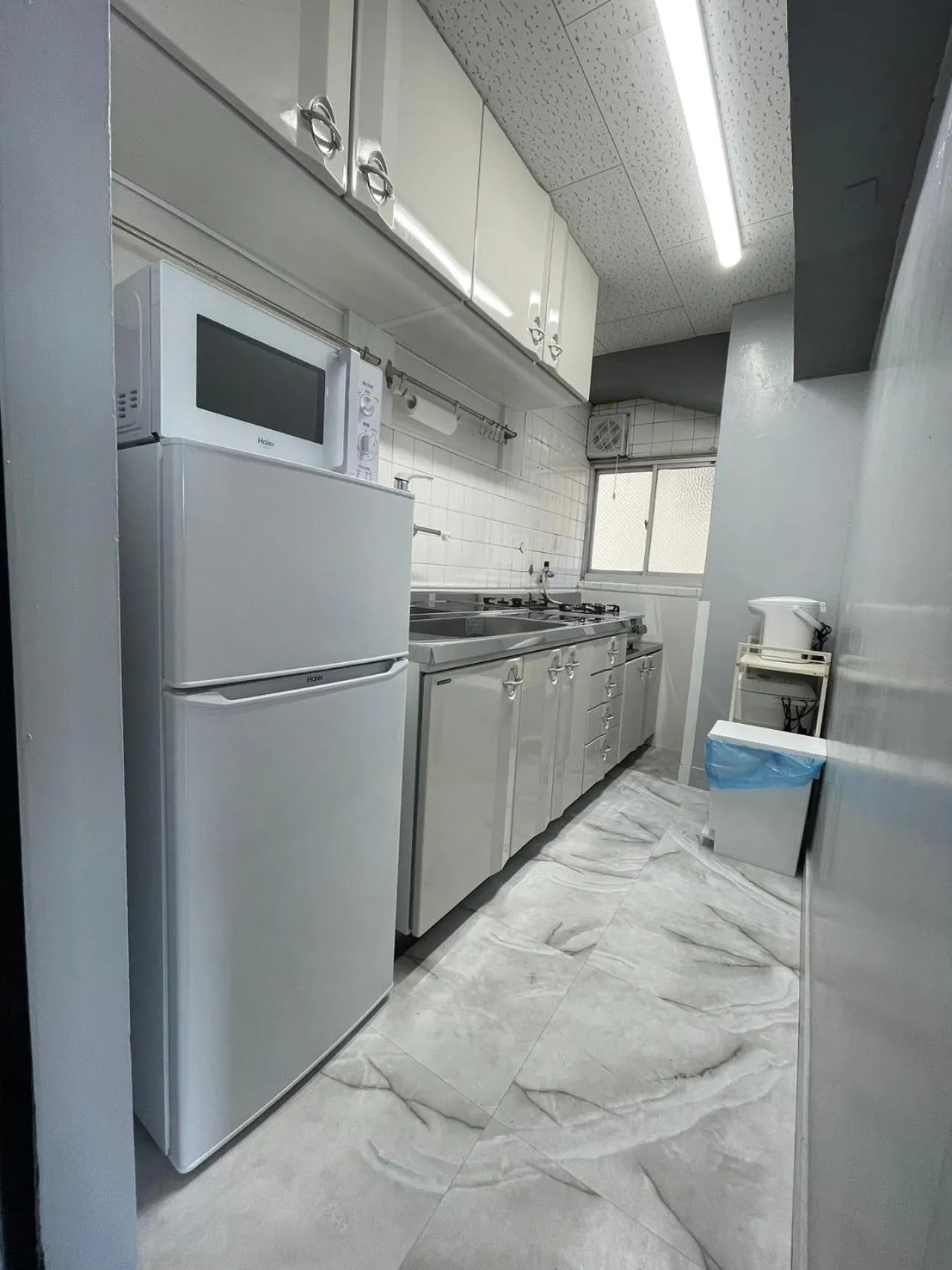 Kitchen or kitchenette in Sea View Court Kobe