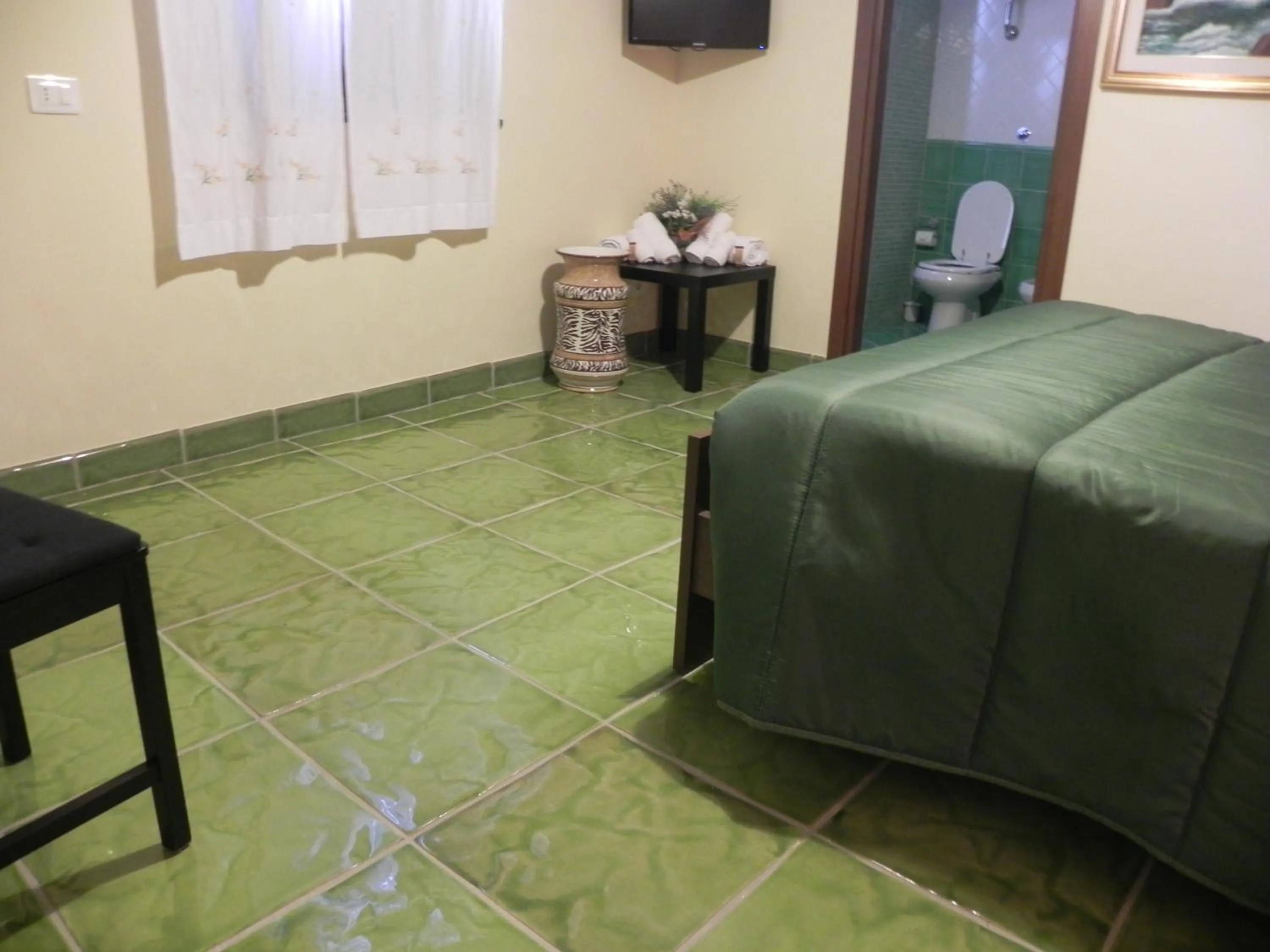 Communal lounge/ TV room in Agriturismo B&B Il Rifugio di Nino