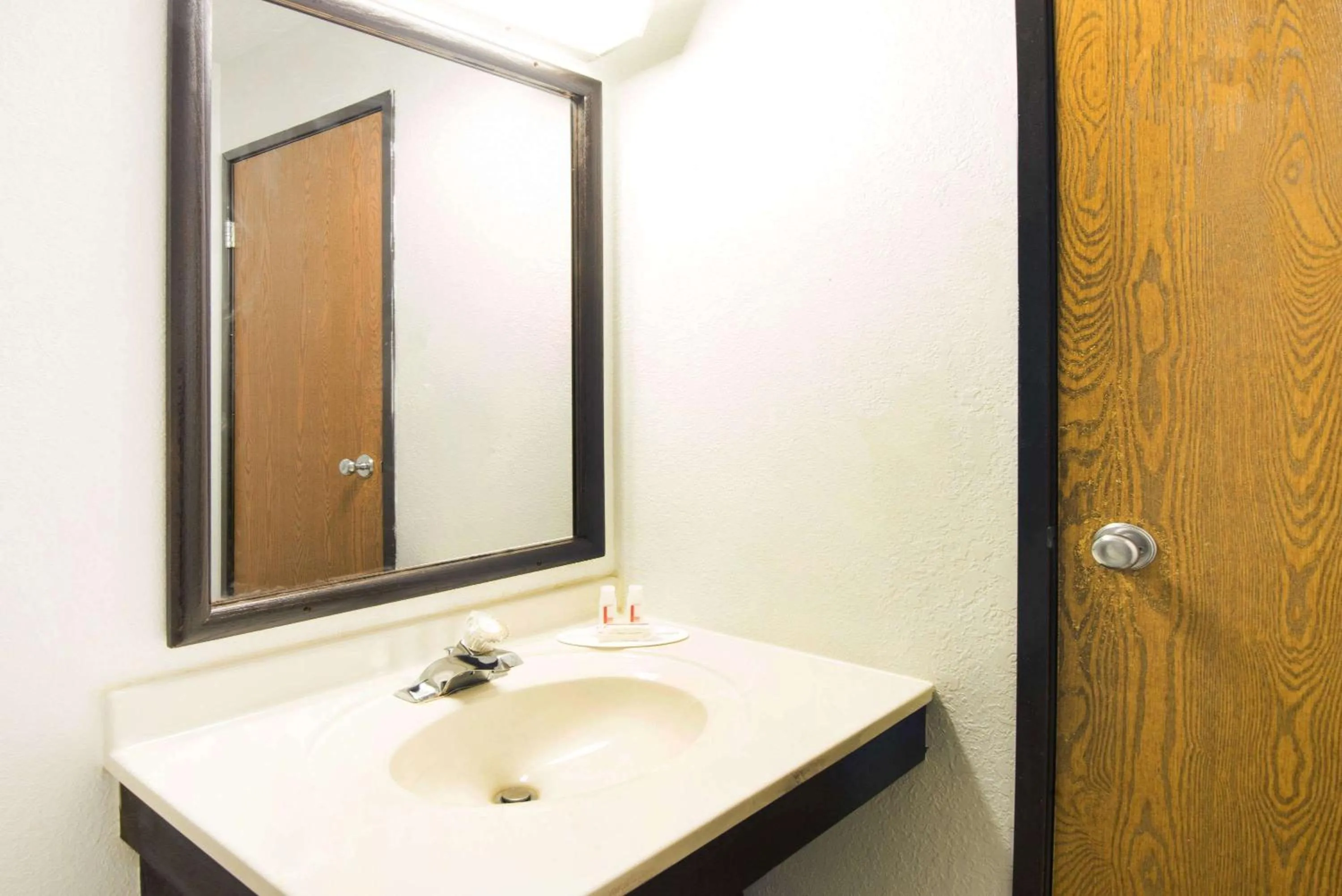 Bathroom in Super 8 by Wyndham Pittsburgh PA Airport-University Area
