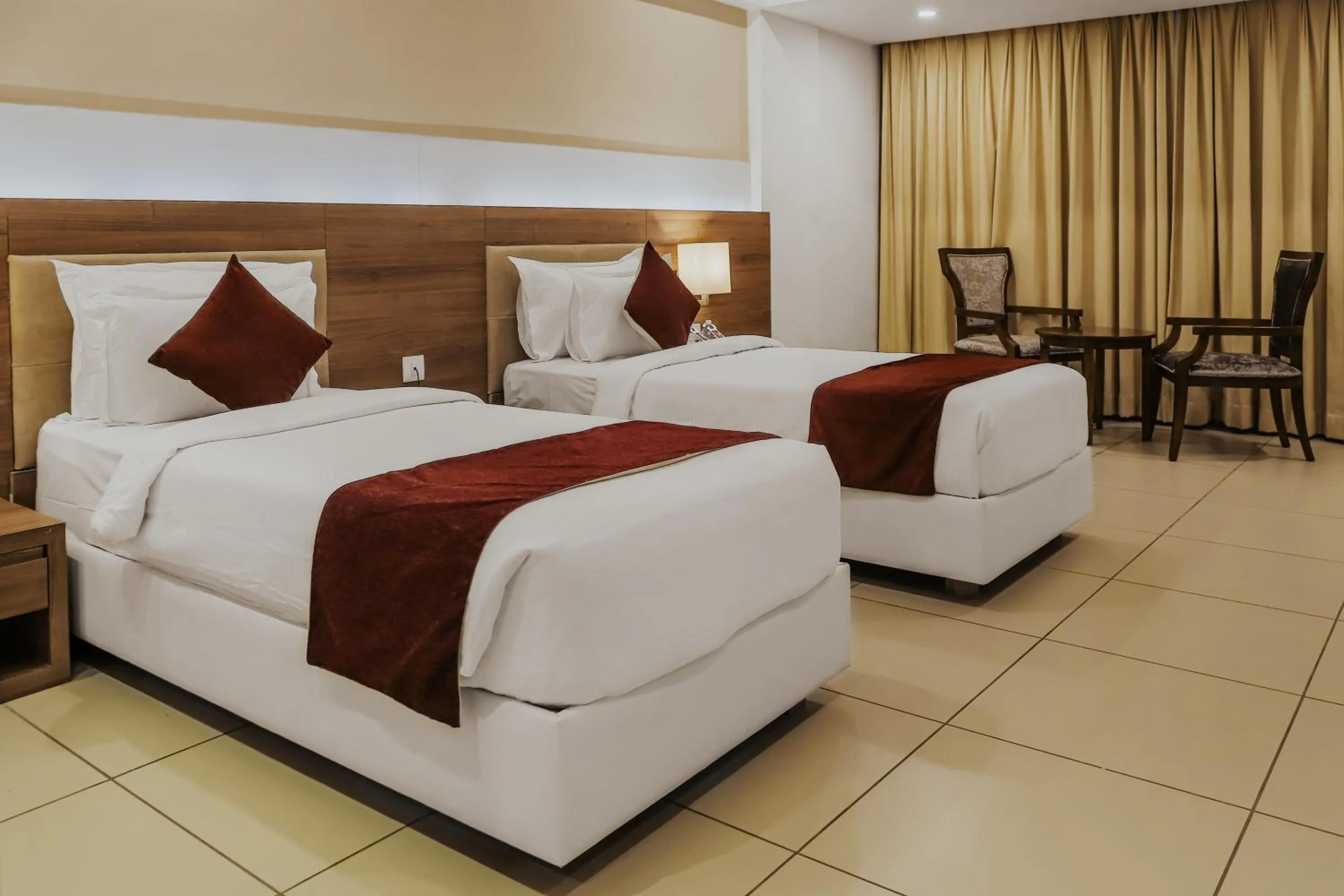 Photo of the whole room, Bed in Regenta Central Somnath, Bhalpara