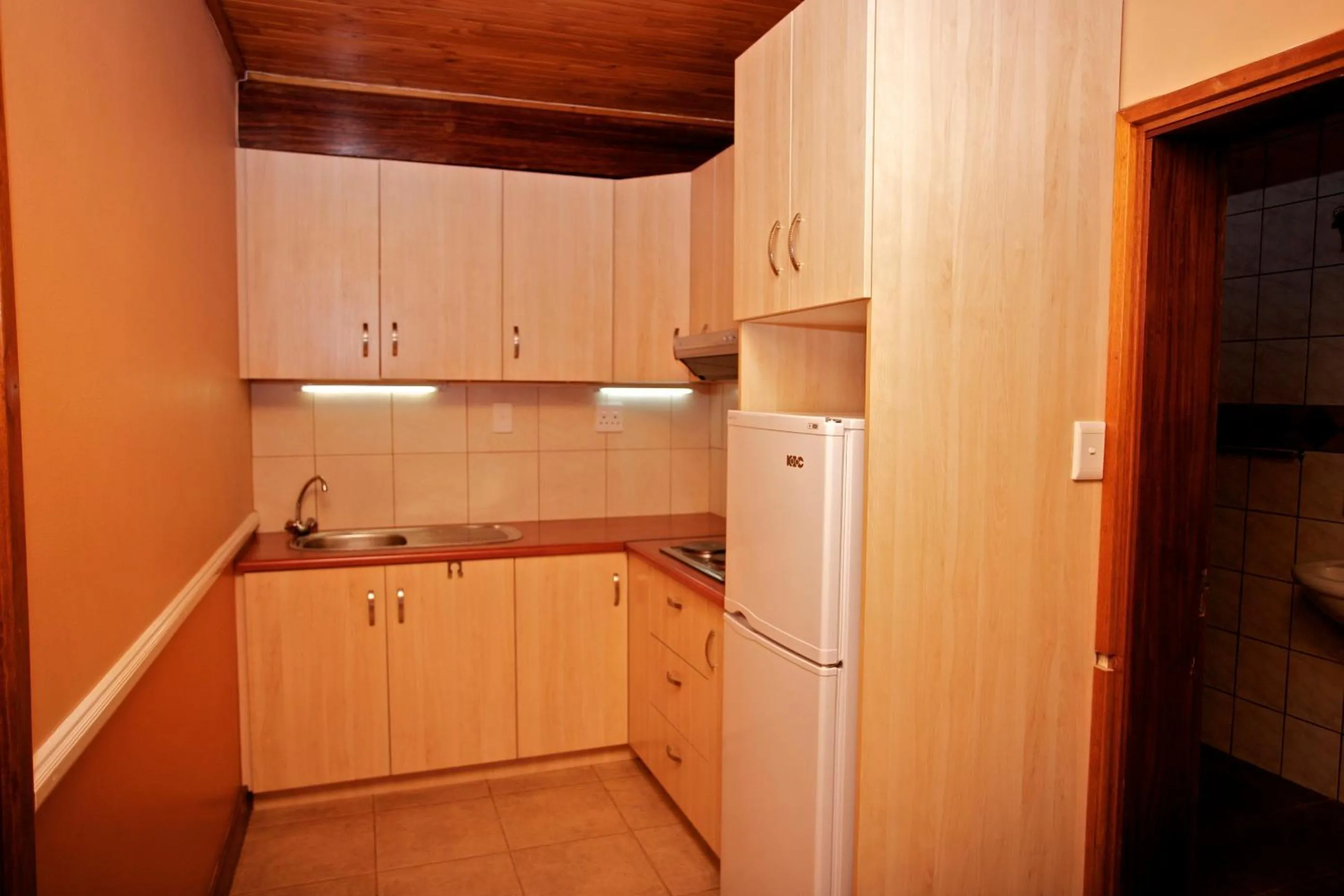 Kitchen or kitchenette in Sandcastle Apartments