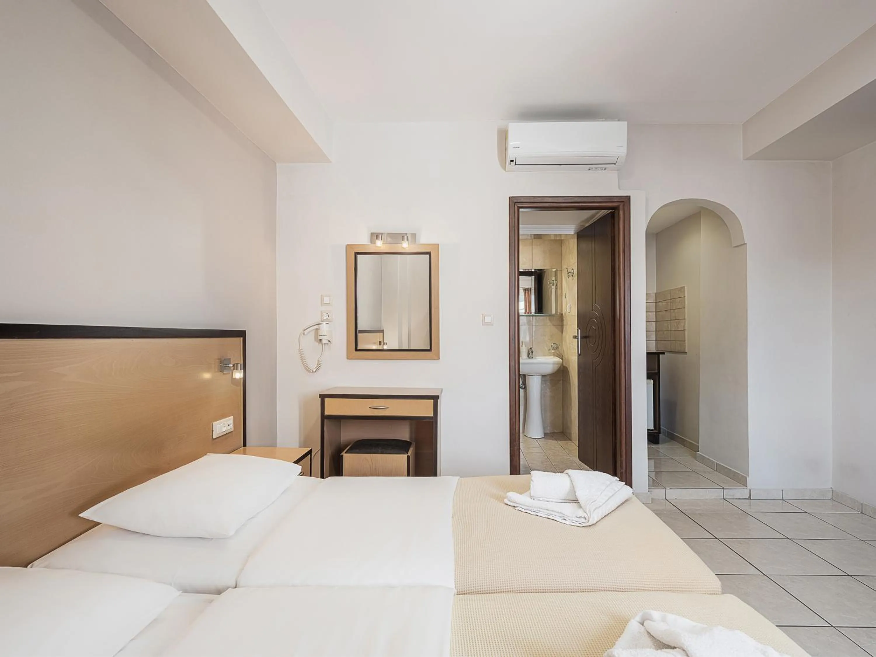 Bed in Theofilos City Hotel