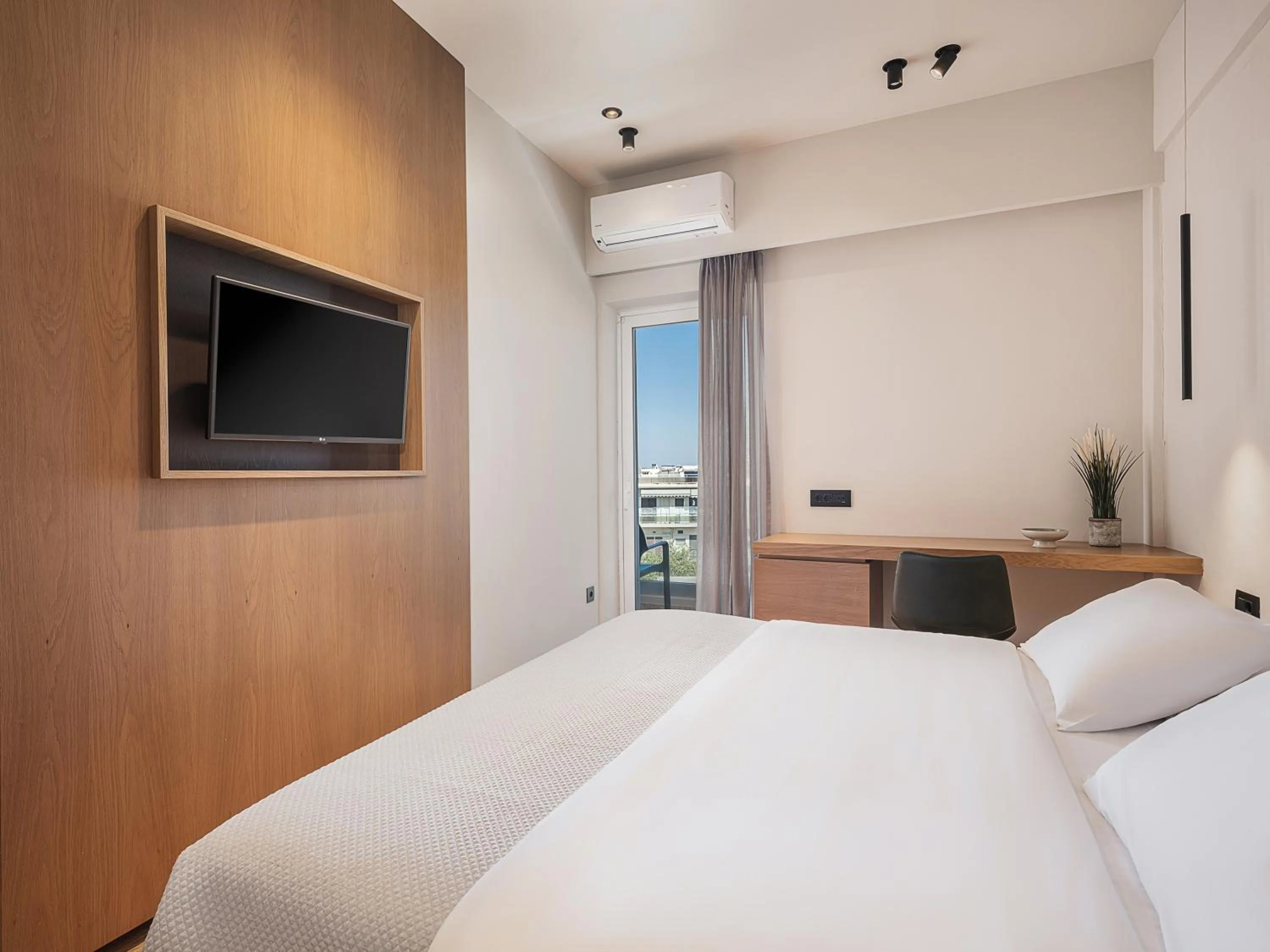 Bed in Theofilos City Hotel