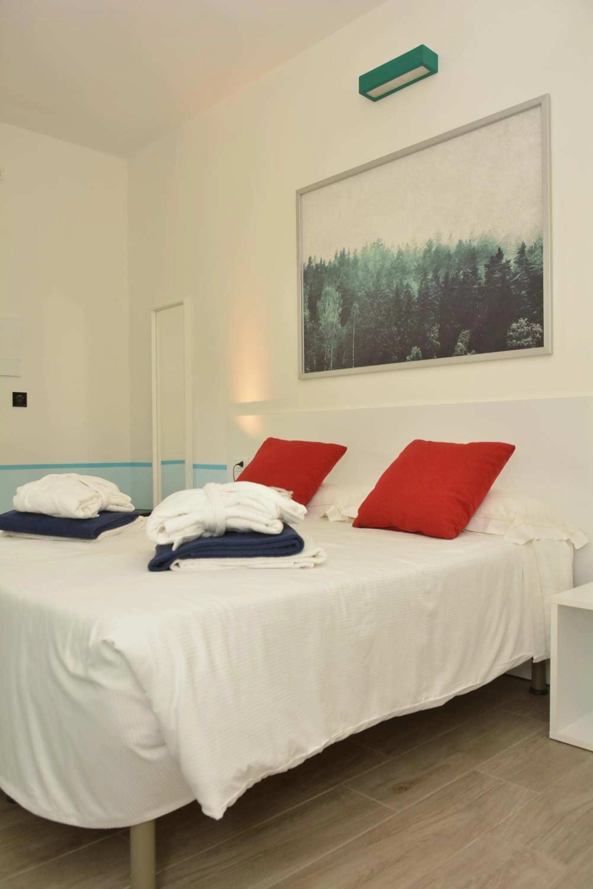 Bed in Golfo del Sole Hotel & Holiday Resort